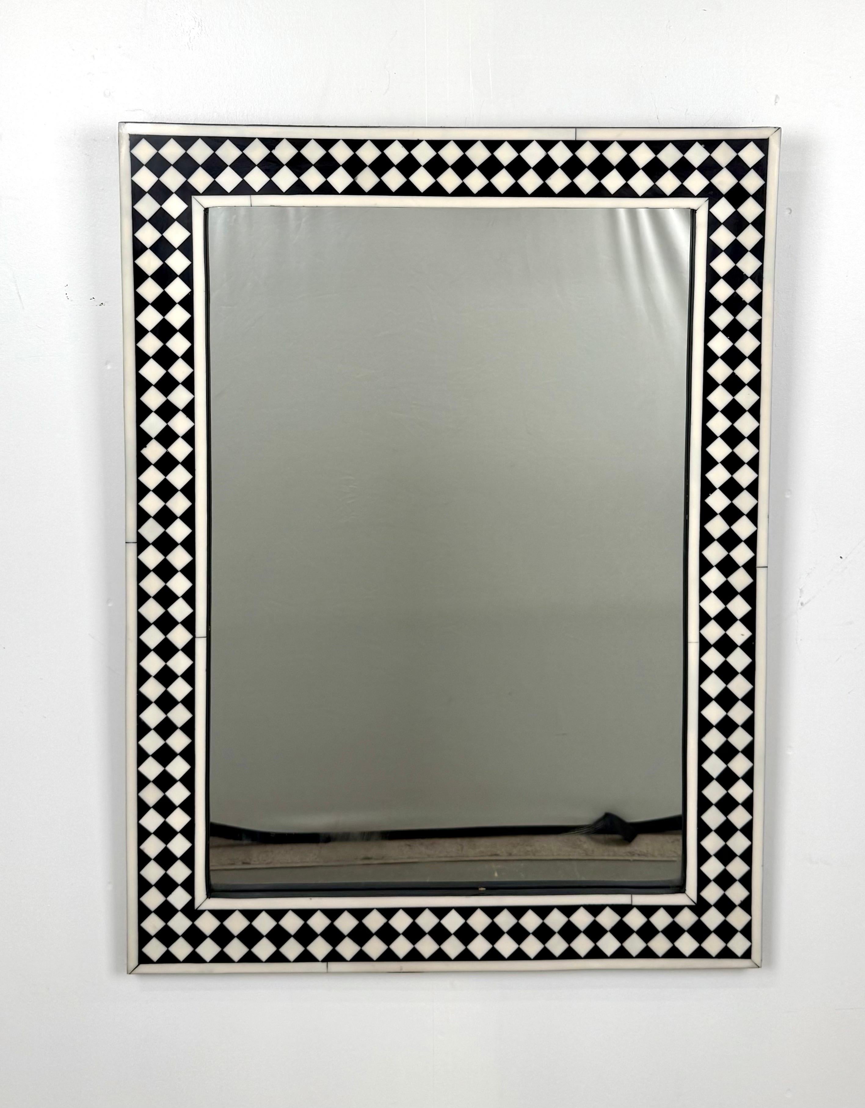 
Art Deco Style Black & White Resin Diamond Design Wall, Table or Mantel Mirror: 

This exquisite Art Deco-style mirror embodies a harmonious blend of geometric precision and timeless sophistication. Encased within a striking black and white resin