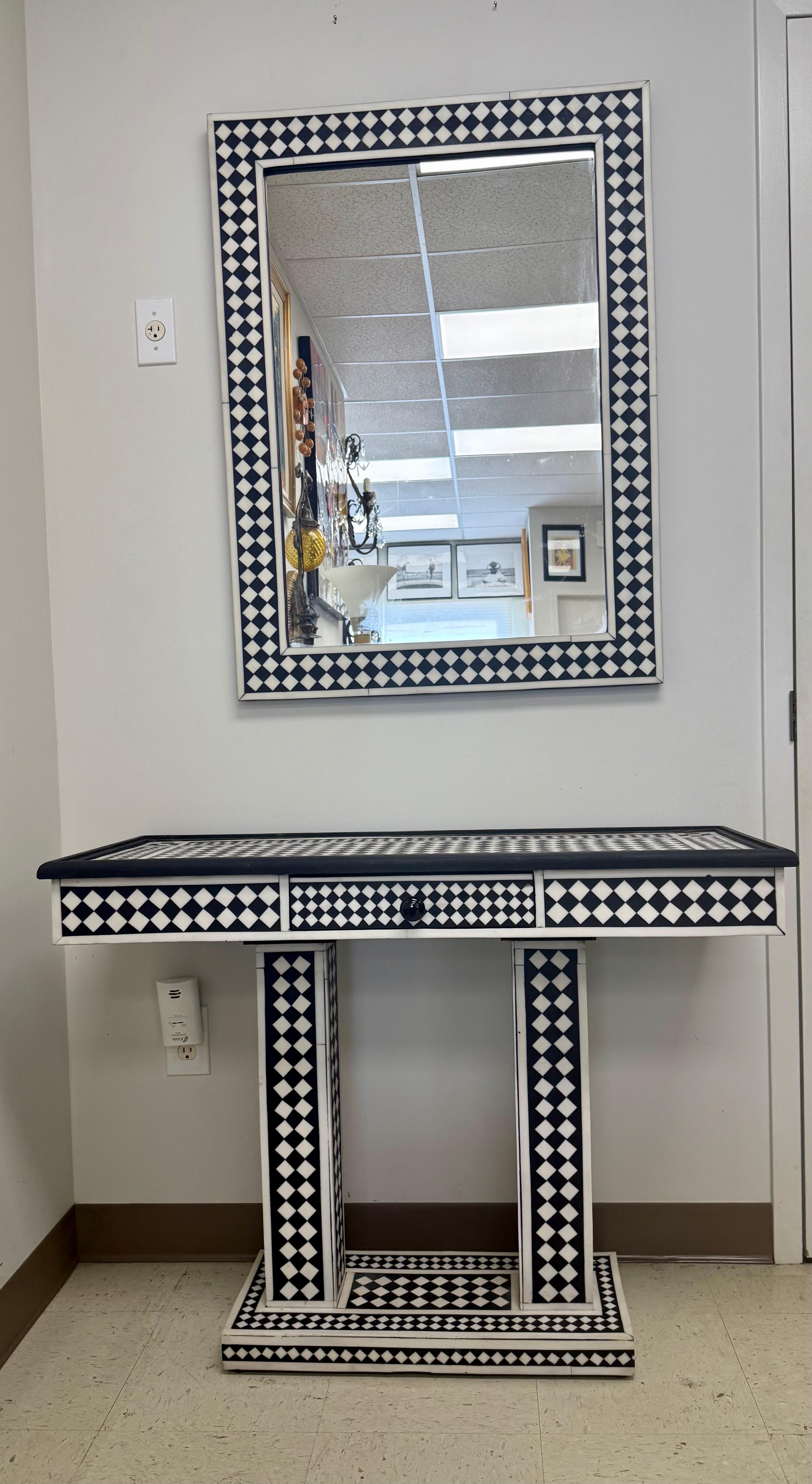 Art Deco Style Black & White Resin in Diamond design Mirror & Console, Set of 2: 

This striking mirror and matching console table exemplify the Art Deco aesthetic, masterfully handcrafted with meticulous attention to symmetry and form. The duo is