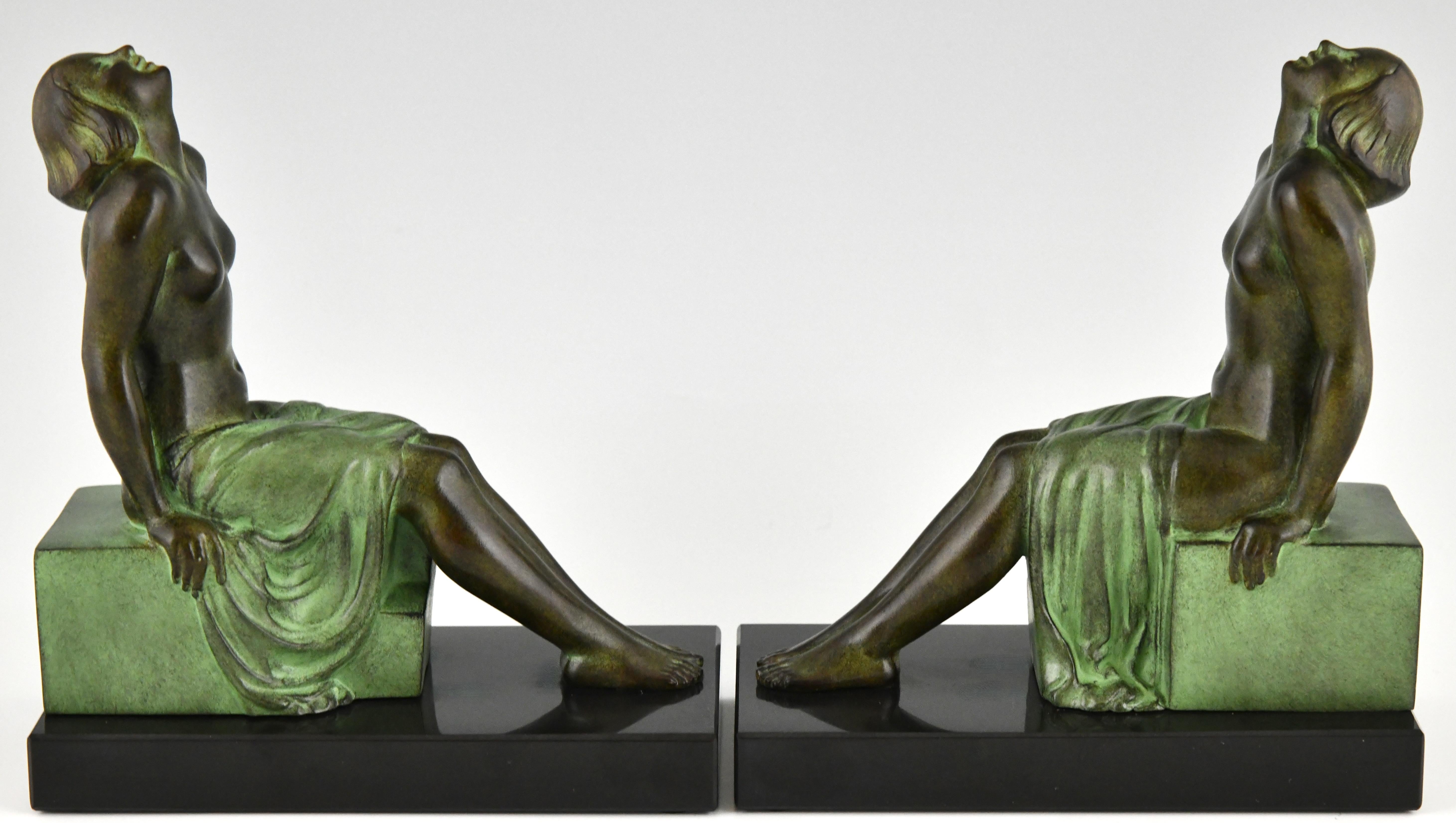Patinated Art Deco style bookends seated nudes Insouciance Janle for Max Le Verrier. For Sale