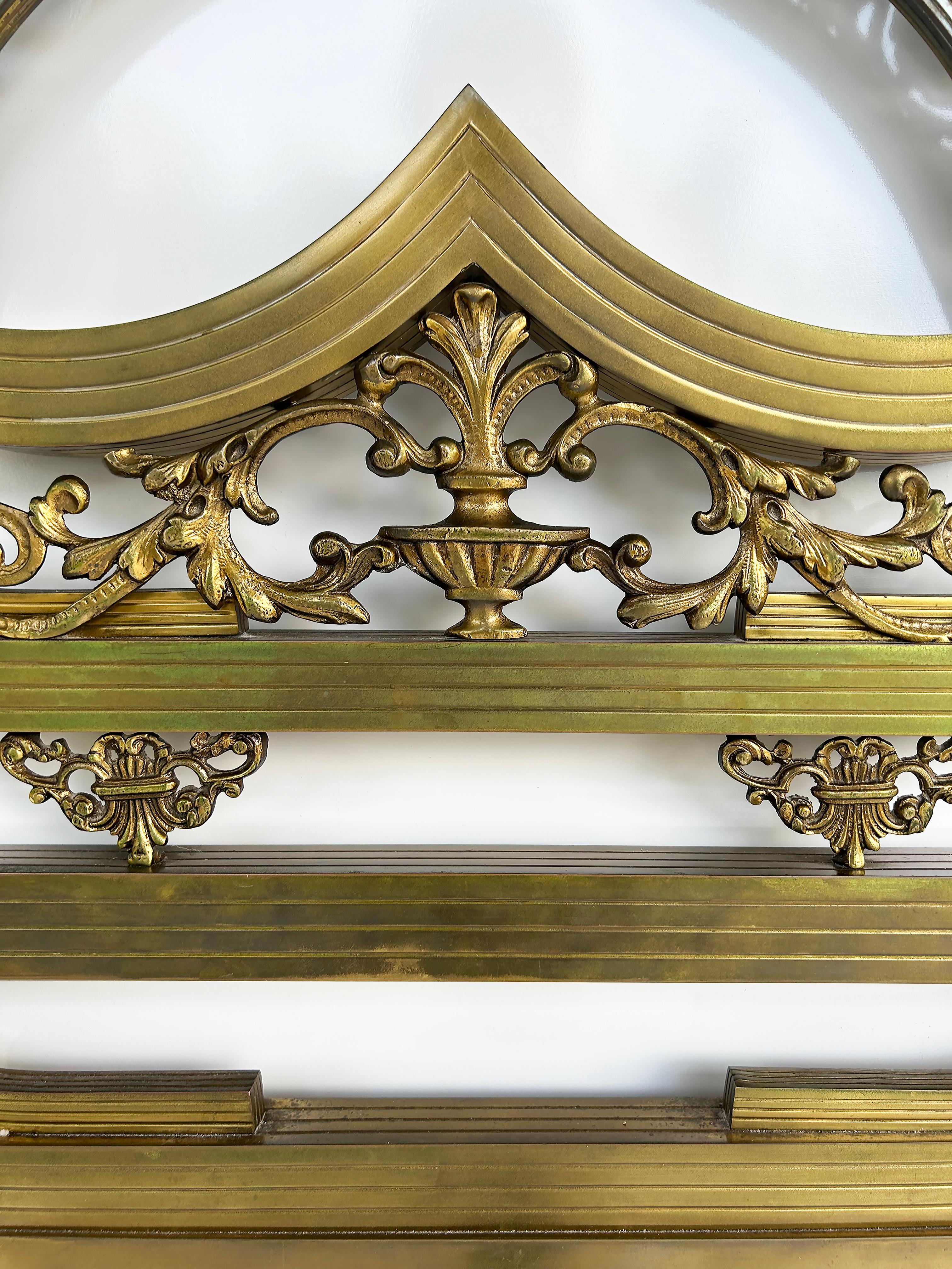 Art Deco Style Brass King Size Headboard with Stylized Urn and Acanthus Design

Offered for sale is an Art Deco-style brass headboard with elegantly detailed casting and worked brass motifs. The headboard has decorative cast feet and brackets to