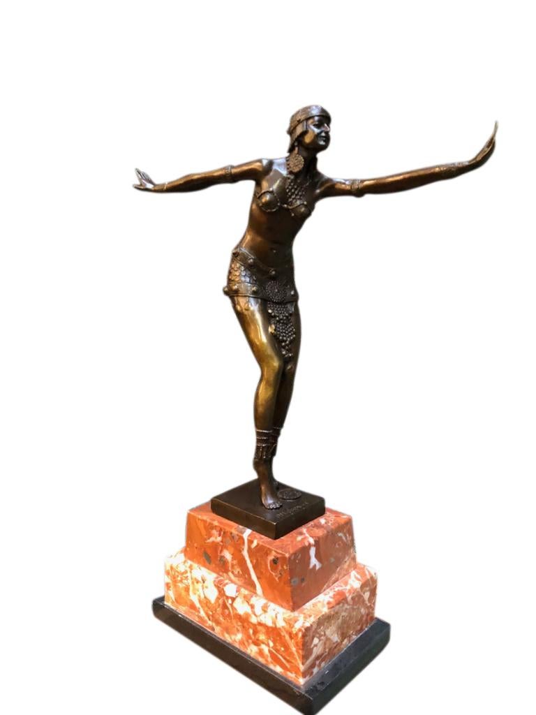 An Art Deco style bronze exotic dancer, J.B Deposee, 20th century. The bronze exotic dancer stands on a Rosa Verona marble. The artist has captured the scene with a fantastic attention to detail. Superb bronze patina.

 