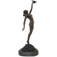 Art Deco Style Bronze Sculpture of a Nude Holding a Bird