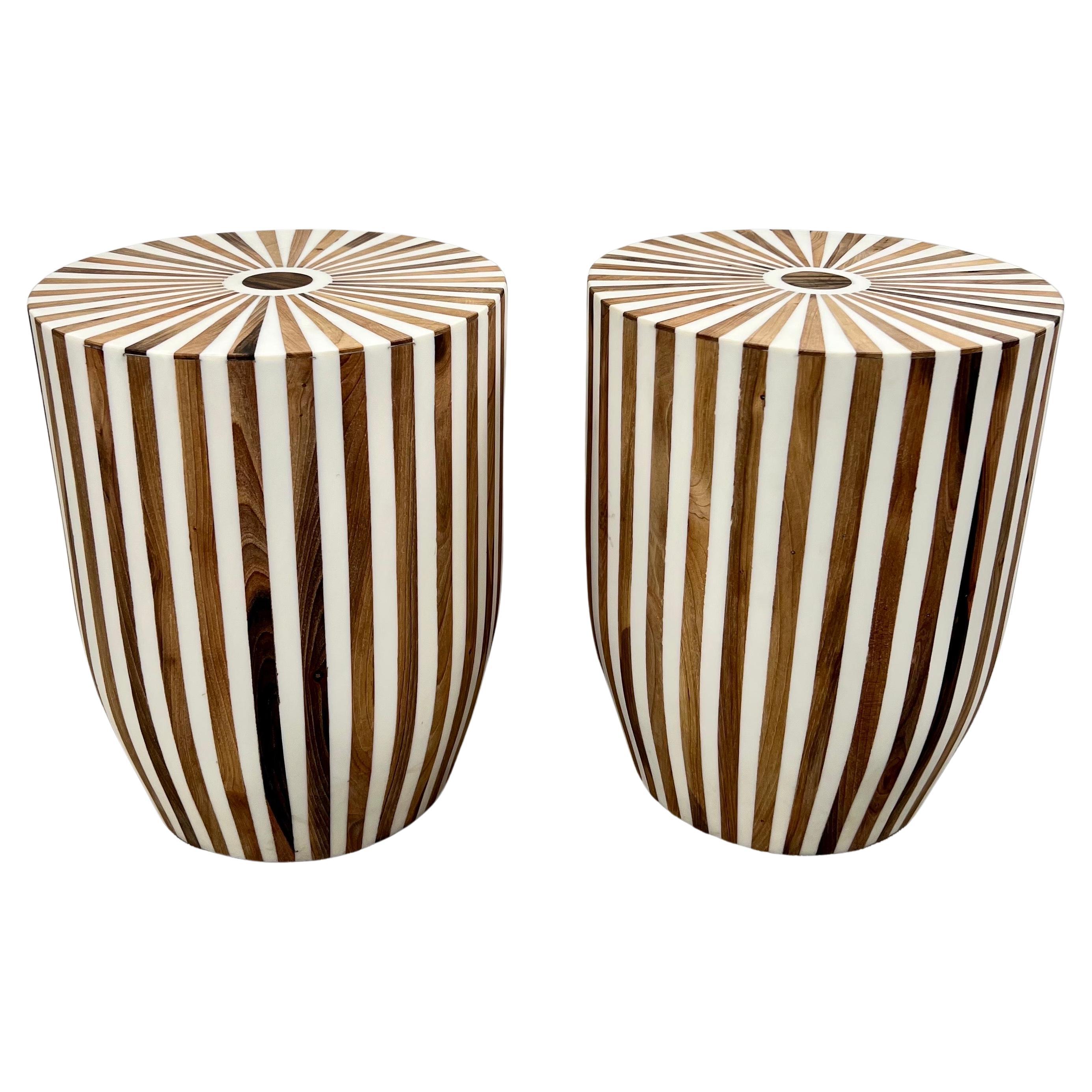 A pair of Art Deco Style Brown & White Cylindrical Walnut and Resin End Tables or Stools: 
This exquisite pair of Art Deco-inspired side tables or stools embodies a striking fusion of geometric precision and bold contrast. Crafted from high-quality