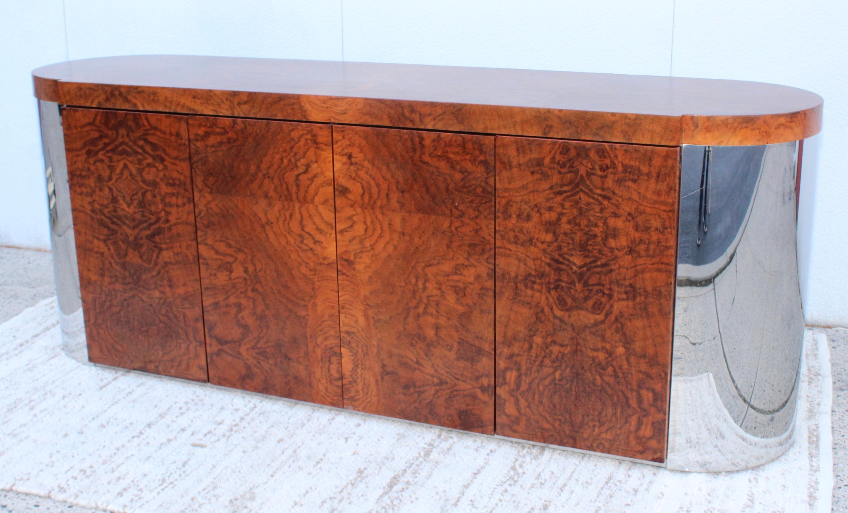 Stunning 1960s well made and very heavy chrome and burl wood Art Deco style credenza with two adjustable shelves. In vintage original condition, with some wear and patina a few repairs to the burl wood.