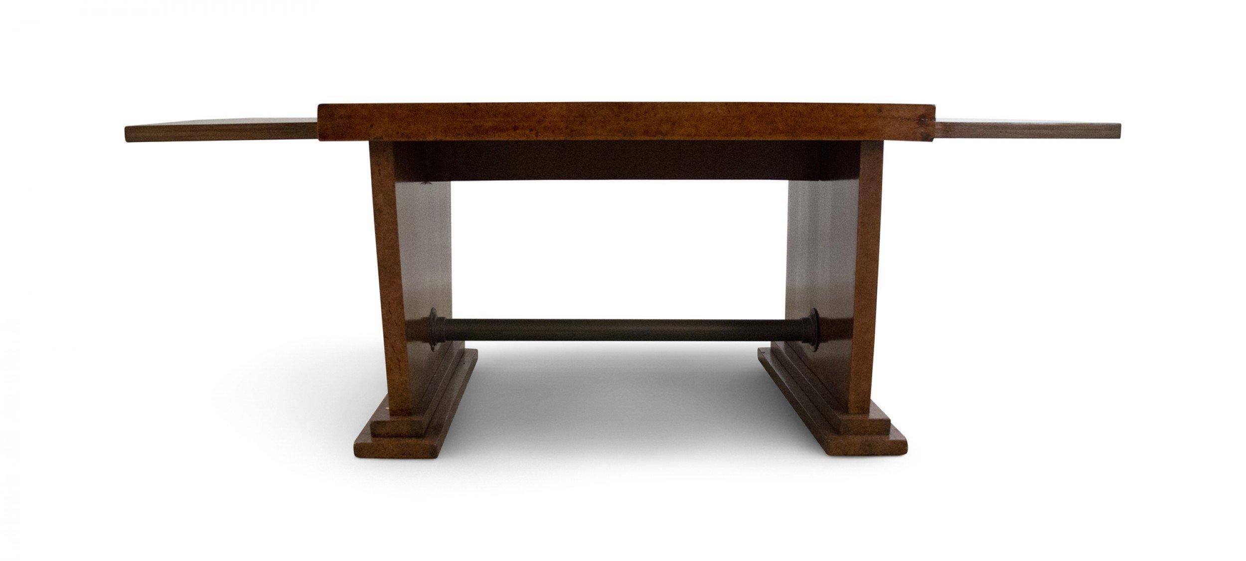 American Art Deco style burl wood coffee table with a raised center section and two slightly lower sides and a patinated bronze stretcher.
    