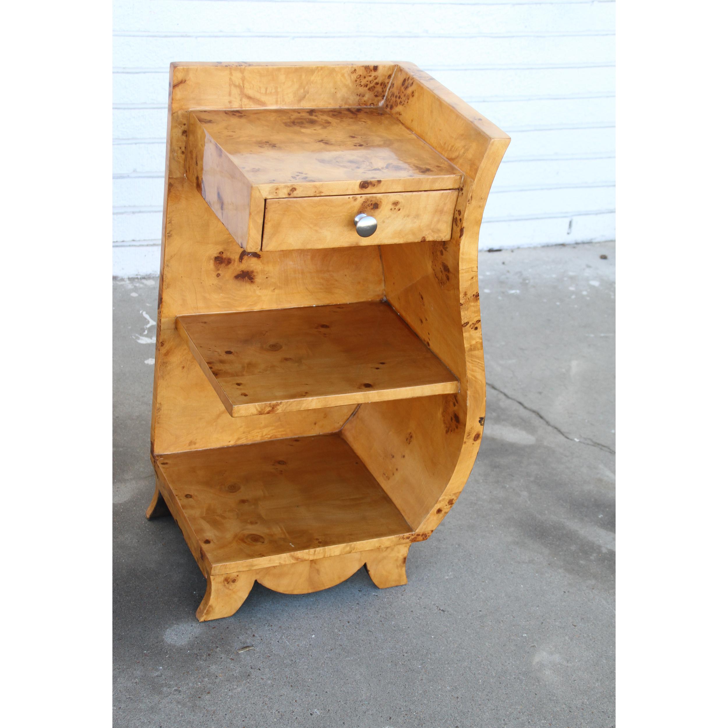 These nightstands are beautifully sculpted in burl wood. They have 3 shelves and a single drawer for storage.
The attractive curves are definite eye catchers. They make a statement in any room.