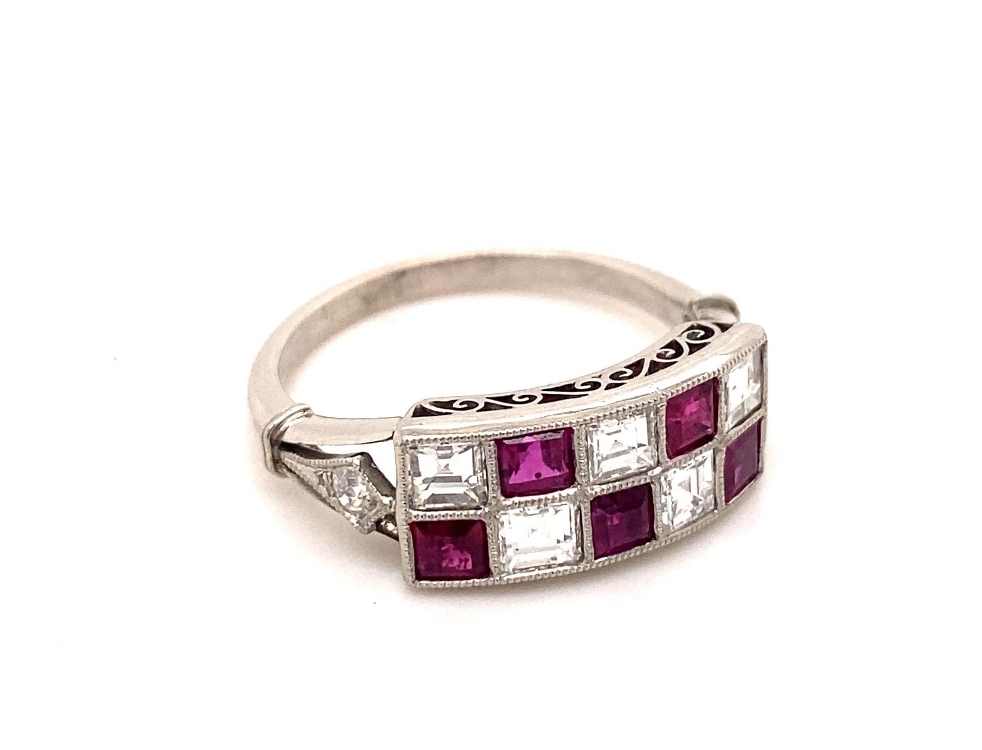 This is a beautiful art style ring set with natural Burma rubies and Ascher cut diamonds in platinum. The ring has a checkerboard like design with alternating rubies and diamonds. The rubies have deep red color and excellent clarity very