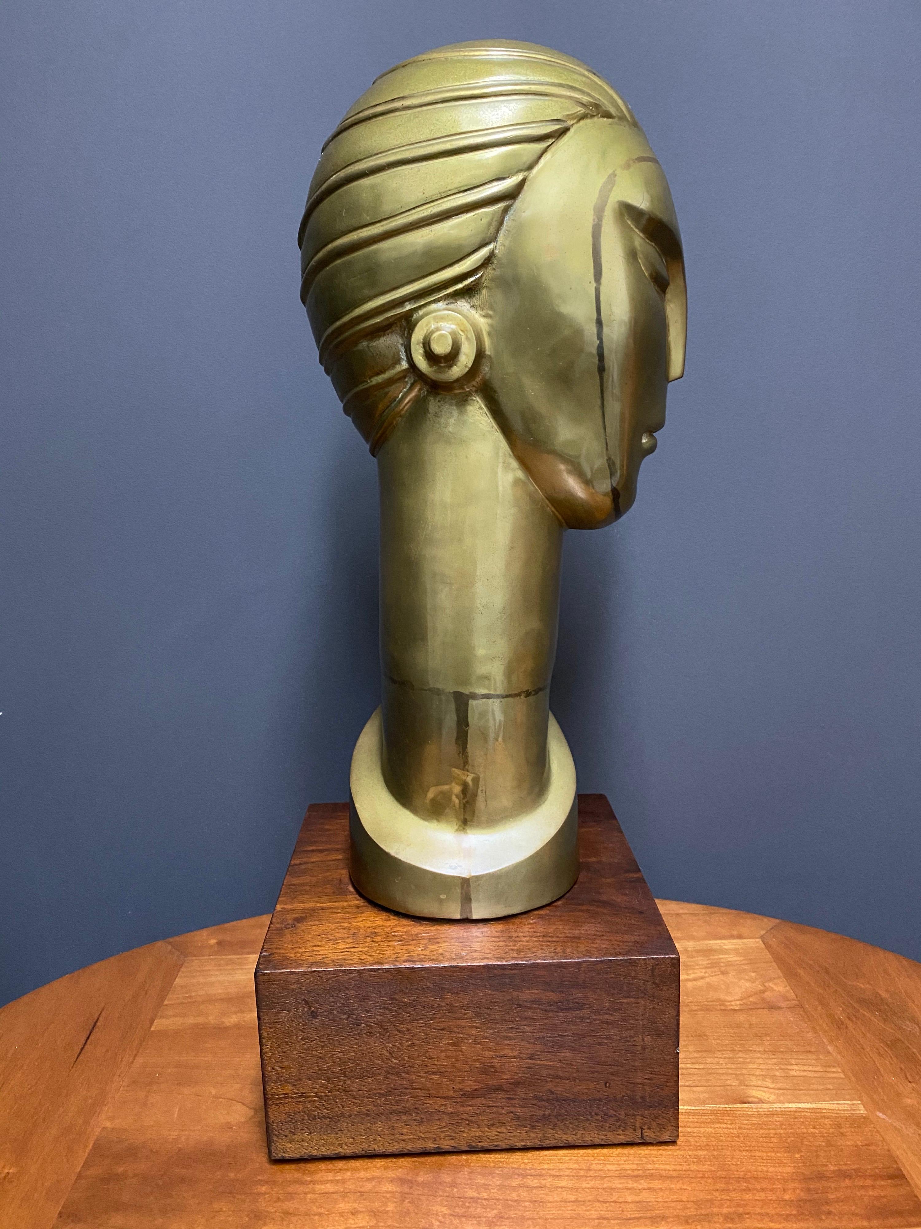 Art Deco style brass bust on square mahogany base. Wonderful patina throughout and presents beautifully.