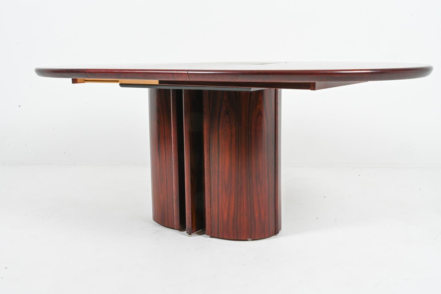 This exquisite dining table embodies the elegance and functionality of Danish Art Deco design. Crafted by renowned Danish furniture maker Skovby, the table seamlessly blends geometric forms with rich materials, creating a statement piece for the