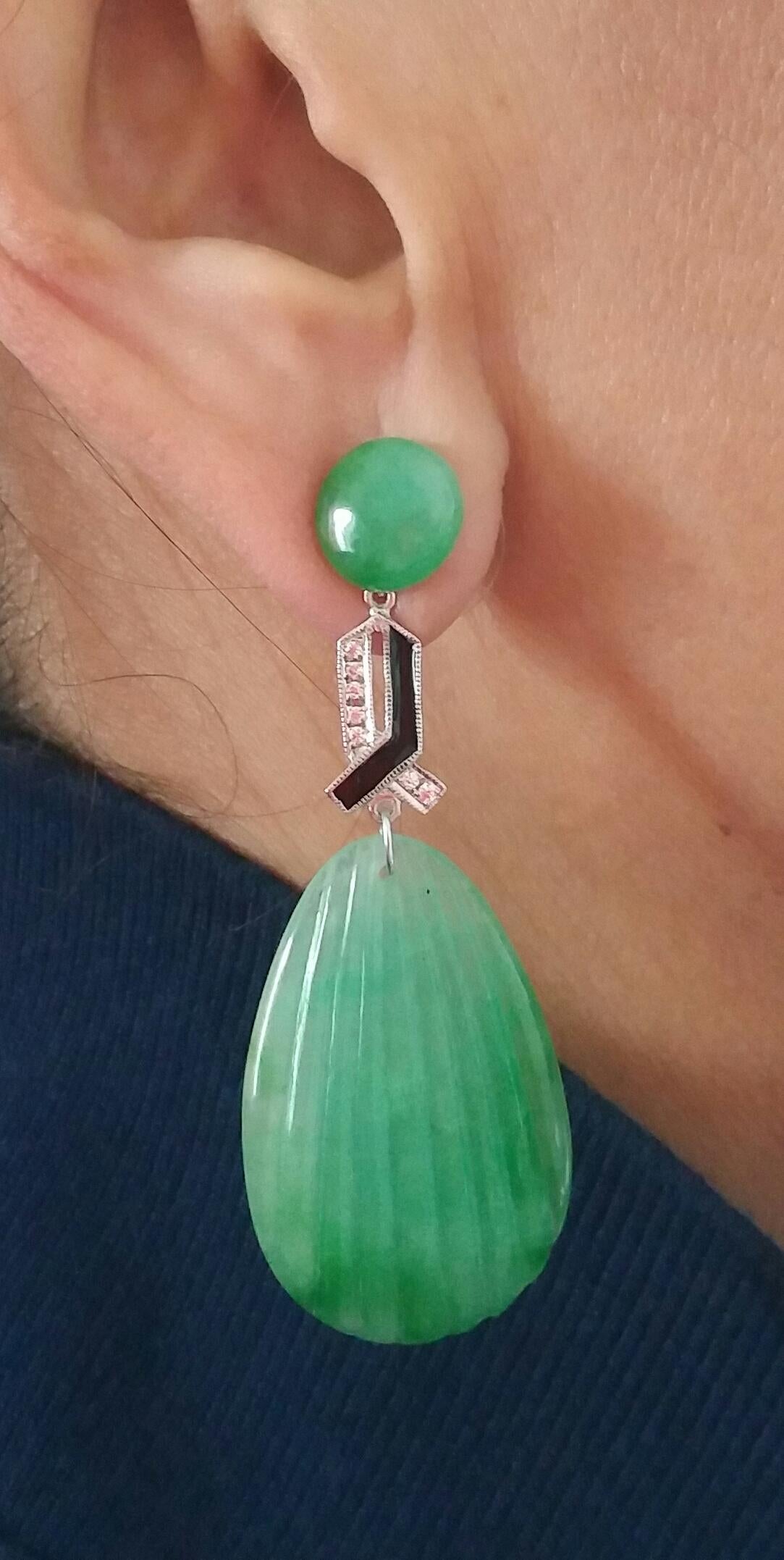 In these classic Art Deco Style earrings we have the tops with 2 round Jade buttons,the middle parts  are composed of 2 elements  in White Gold , Diamonds and Black Enamel,while in the bottom parts  we have 2  Burma Jade shell style carved flat