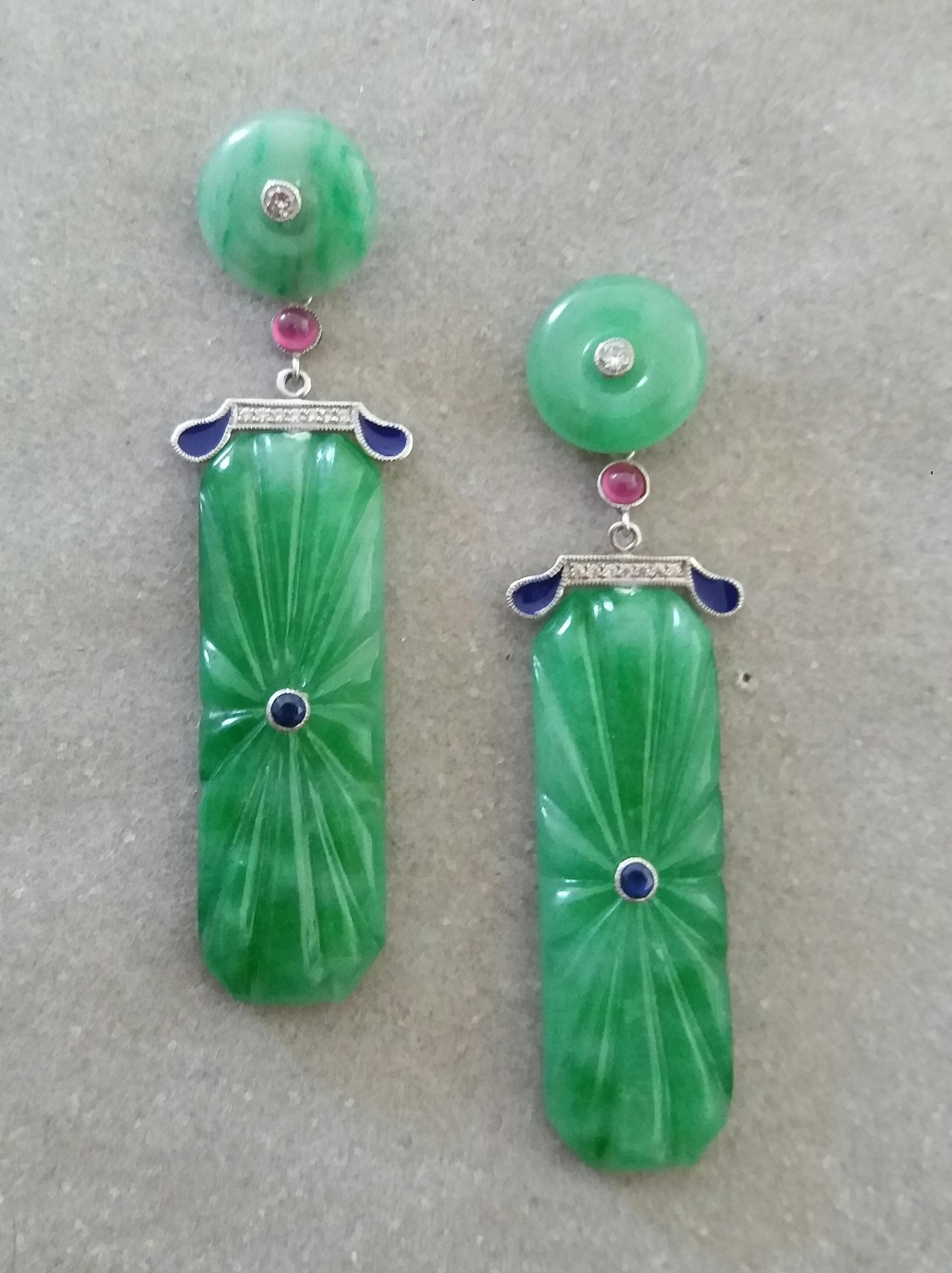 In these classic Art Deco Style earrings we have the tops with 2 Jade discs with small diamonds set in gold in the center ,the middle parts are composed of 2 small ruby cabs 
 and 2 elements in White Gold, Diamonds and Blue Enamel,while in the