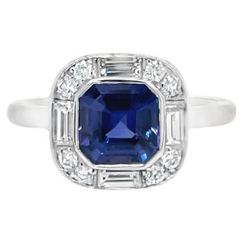 This one of a kind handmade made art deco style ring features a GIA certified Ceylon sapphire weighing 1.63cts. Sapphire is mounted in a bezel setting and is surrounded by baguette and round brilliant diamonds, 0.50tcw. Diamonds are colorless and