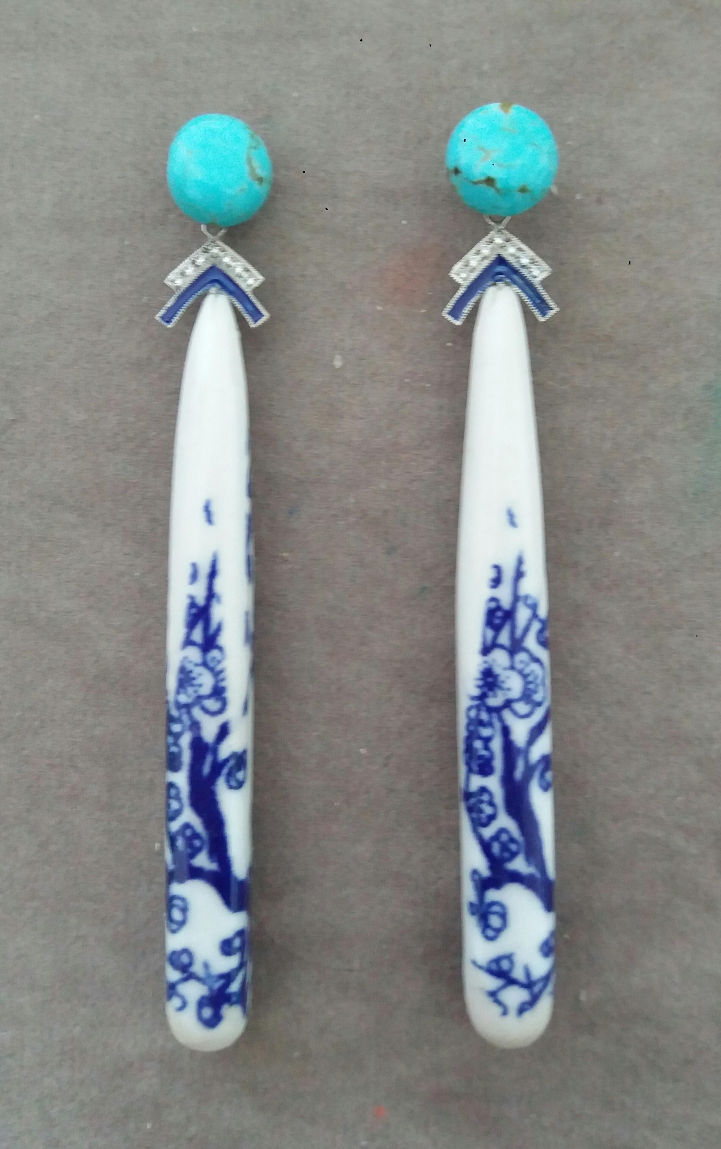 In these Unique Earrings we have 2 Chinese Ceramic Drops 70 mm. long ,depicting a floral patterns , suspended to 2 Genuine Turquoise  buttons of 10 mm in diameter and 2 elements in white gold, blue enamels and 14 small full cut diamonds.

In 1978