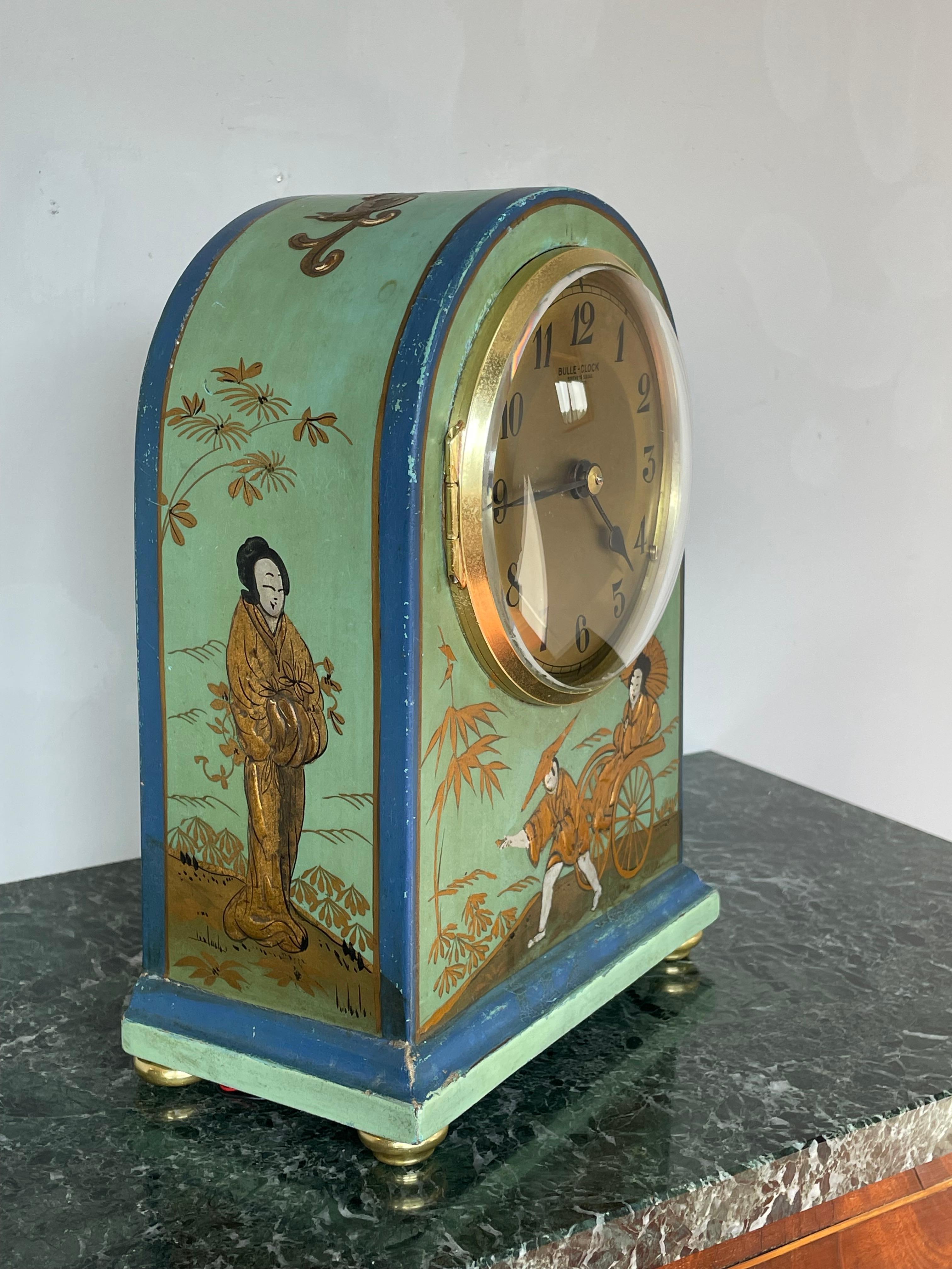 Handcrafted and rare, Asian style, hand-painted & gilt table, desk or mantel clock.

This rare combination-of-styles clock is in good condition, in perfect working order and a joy to own and to look at. We had never before seen a 1930s table clock