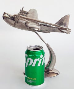 Scultura da scrivania in stile Art Déco raffigurante un aeroplano con elica cromata
