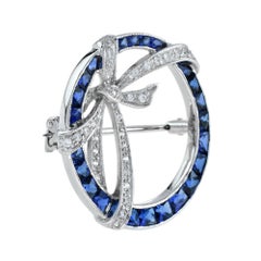 Art Deco Style Circle with Ribbon Bow Halo Blue Sapphire & Diamond Pin Brooch