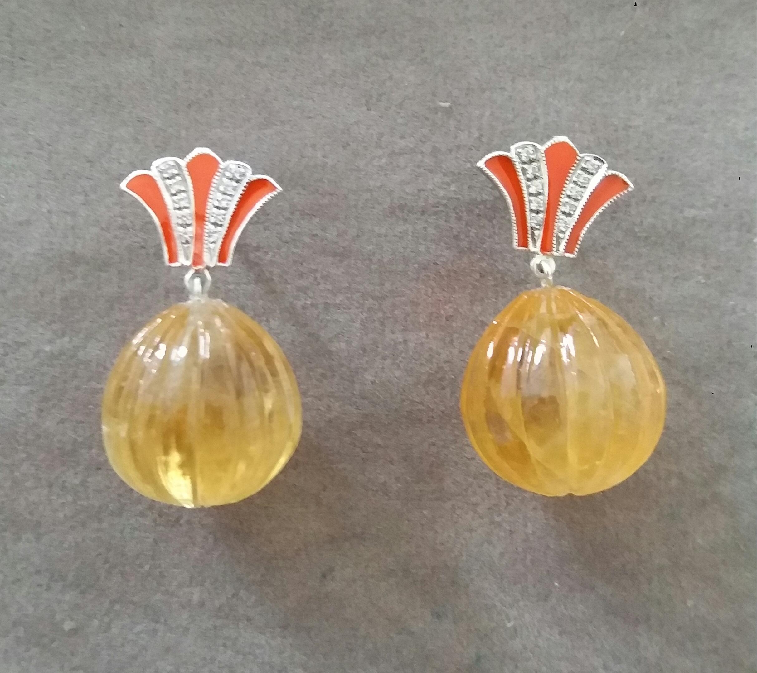 Unique pair of  Citrine Carved Drops earrings with on top 2 white gold elements  in a Crown shape with 20 full cut round Diamonds and Orange Enamel. In the bottom parts we have 2 Citrine Carved Round Drops measuring 15 x 16 mm.

In 1978 our workshop