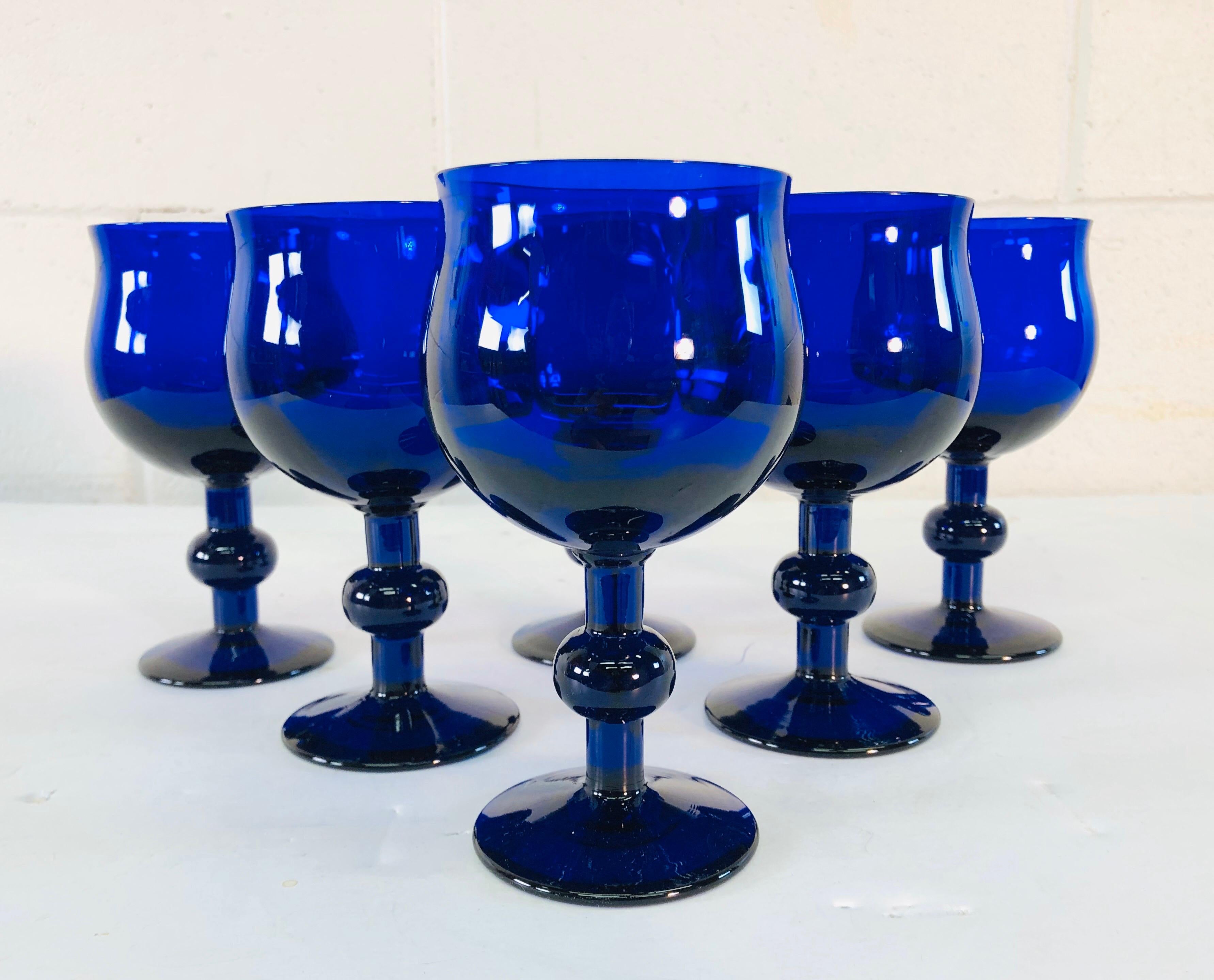 Art Deco style set of 6 cobalt glass wine stems with a ball accented stem. No marks. Excellent condition.