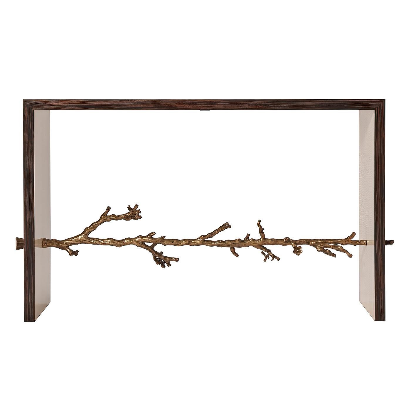 An Art Deco-inspired faux ebony veneer console table with natural fiddle back sycamore interior with a cast brass flowering branch cross stretcher.

Dimensions: 52