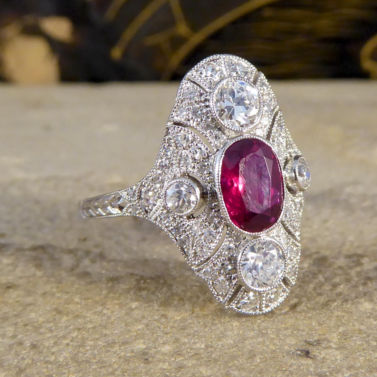 The design of this ring has been inspired from the classic Art Deco period, however has been crafted recently. Modelled in Platinum, the design features an oval cut 0.80ct Ruby in the centre with a surround of Diamonds. This navette-shaped plaque