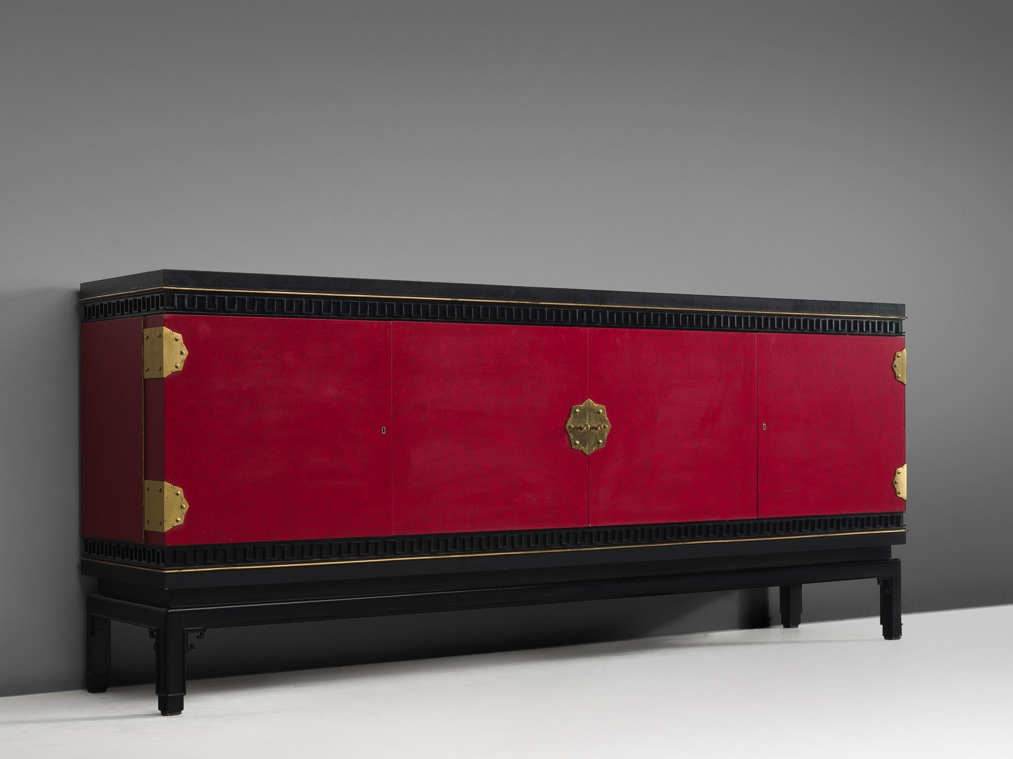 Sideboard, in oak, brass and skai, by De Coene, Belgium, 1960s. 

Rare early Art Deco style sideboard in oak and skai, signed by Belgian De Coene Frères. This credenza shows a beautiful deep red color with brass details. The detailing has hints of