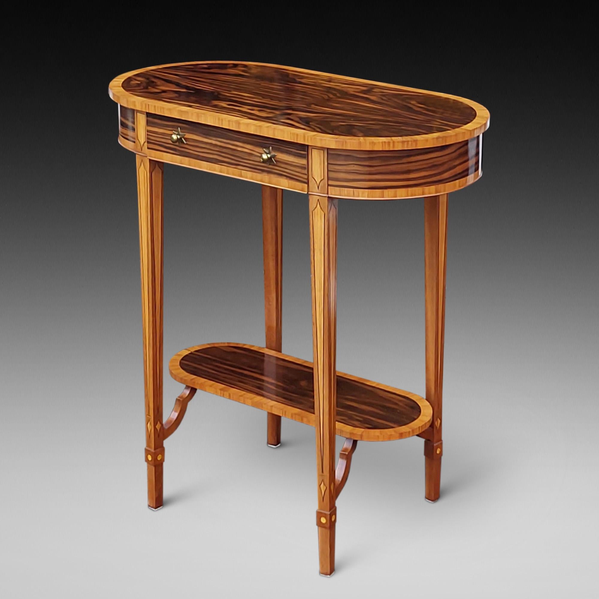 Art Deco style Crossbanded Macassar Ebony Lamp Table the tapering legs supporting the superstructure and under-shelf  