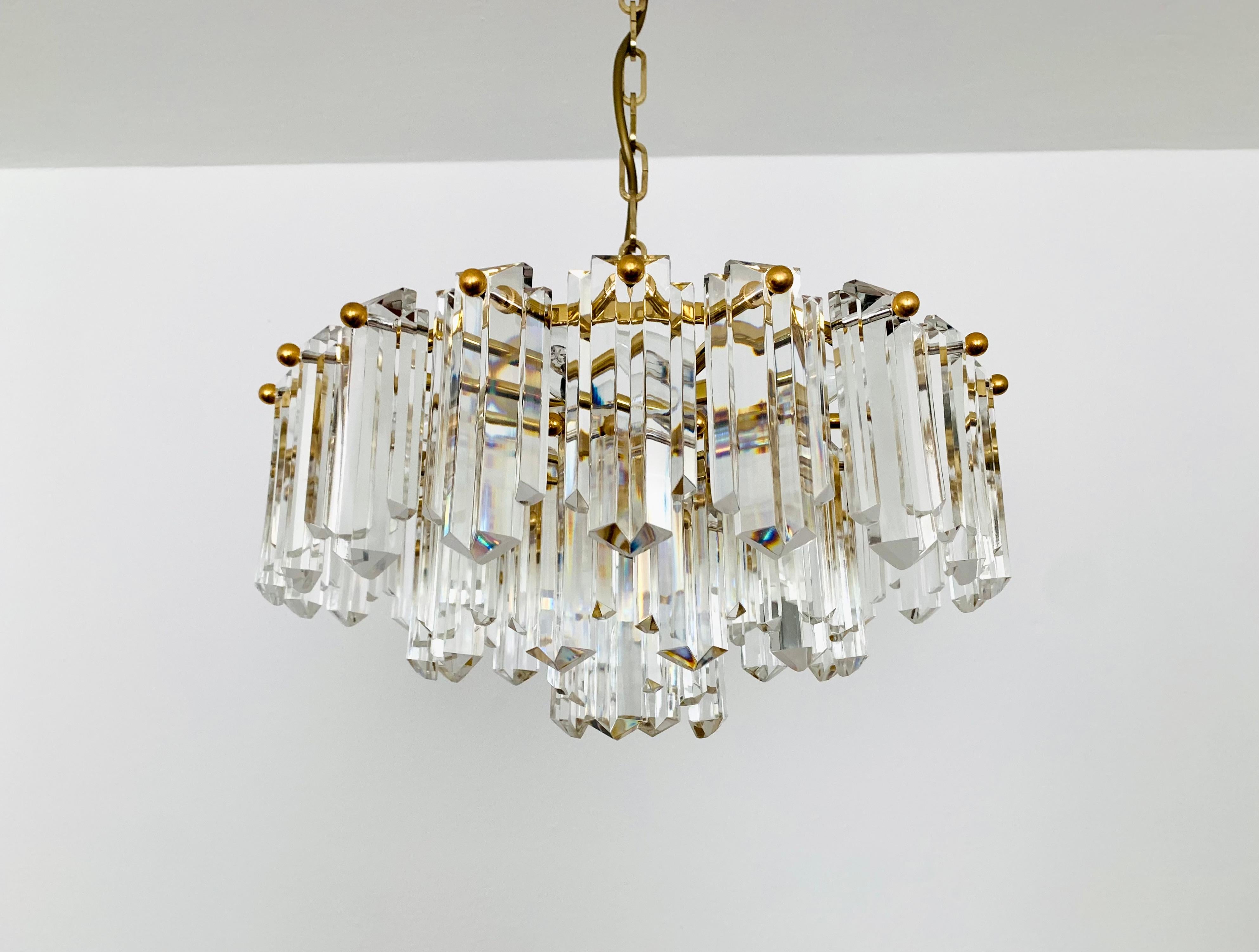 Wonderful chandelier from the 1960s.
The 36 beautifully shaped Art Deco glass elements create an impressive, sparkling play of light.
Exceptionally high-quality workmanship.
Very noble and luxurious appearance and a real eye-catcher for every