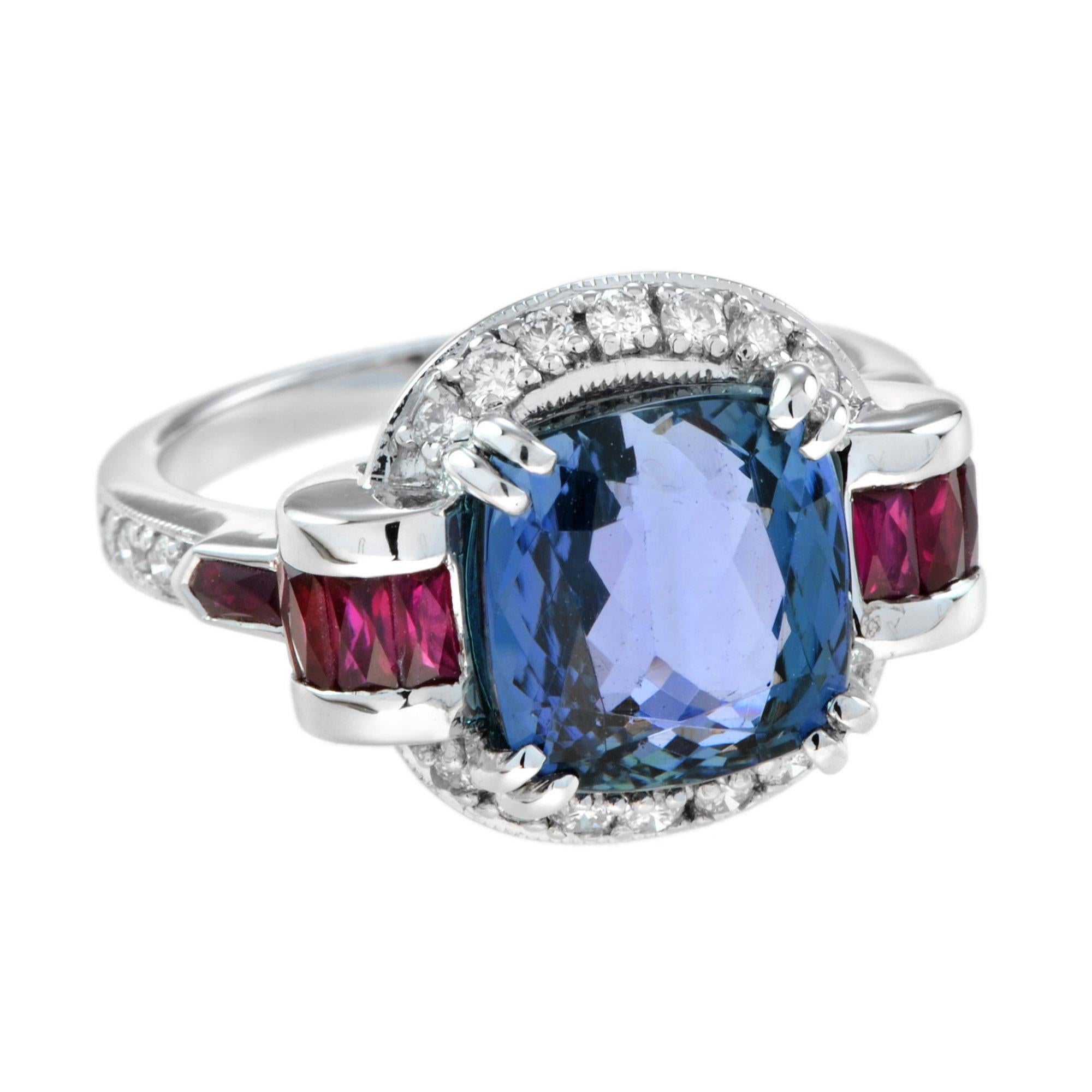 A gorgeous eye catching center stone with the perfect touch of diamonds and rubies. The tanzanite is a nice size at 10 x 9.5 mm., 6.15 carats. The tanzanite is eye clean and has a beautiful rich bluish purple hue. The center stone is enhanced by the