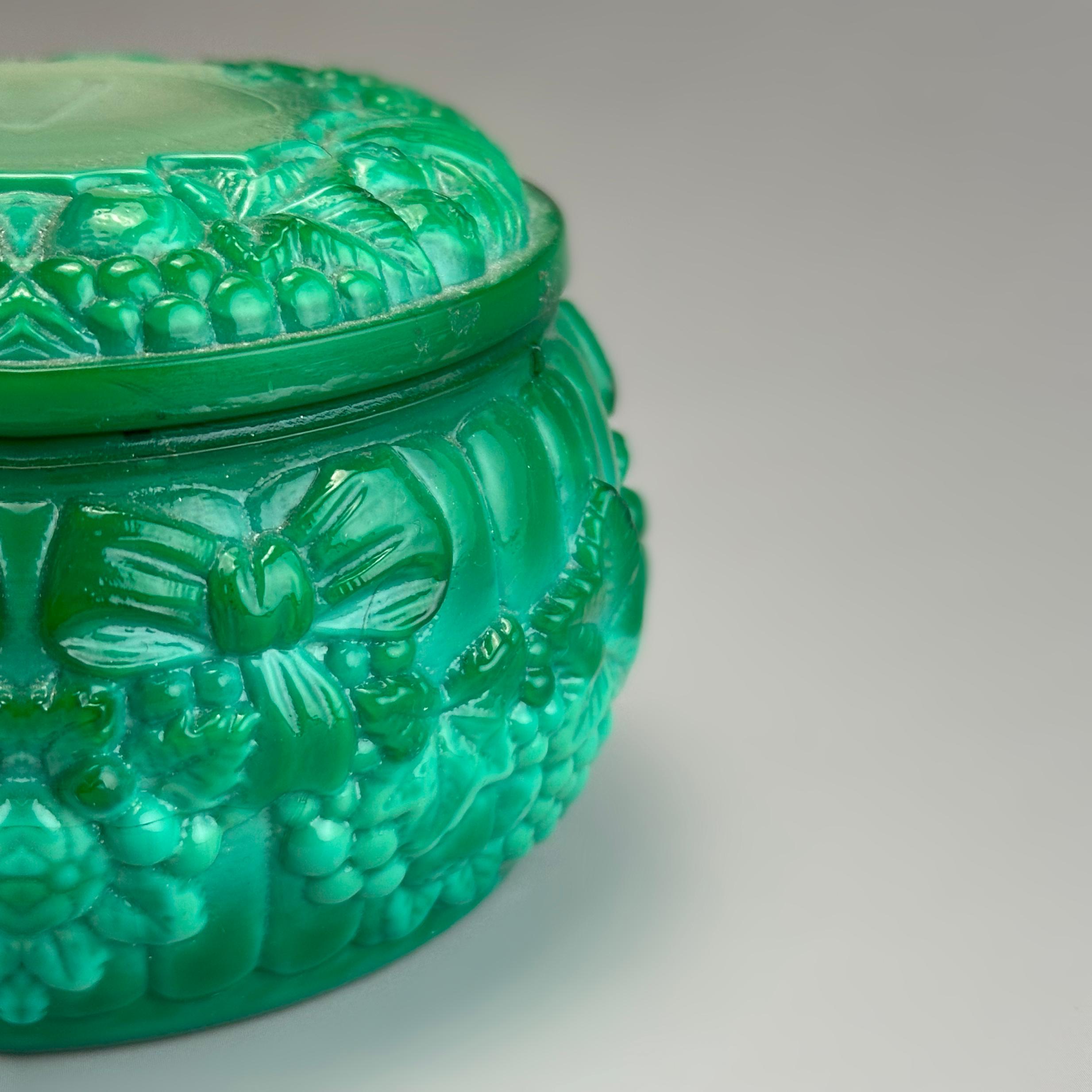 A vivid green malachite glass trinket box, produced in 1960s Czechoslovakia (modern-day Czech Republic), using the original moulds from the studios of Heinrich Hoffmann and Curt Schlevogt—two of the most significant figures in early 20th-century