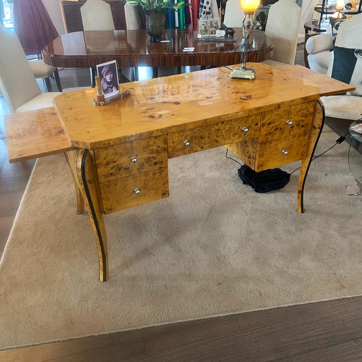 Art Deco Style, fantastic Desk in intricate Burl Birch with large top work area, 5 Drawers and additional slide out work areas to both left and right, extending the top work area. The Desk has stepped and inset geometric details to draws, with 4