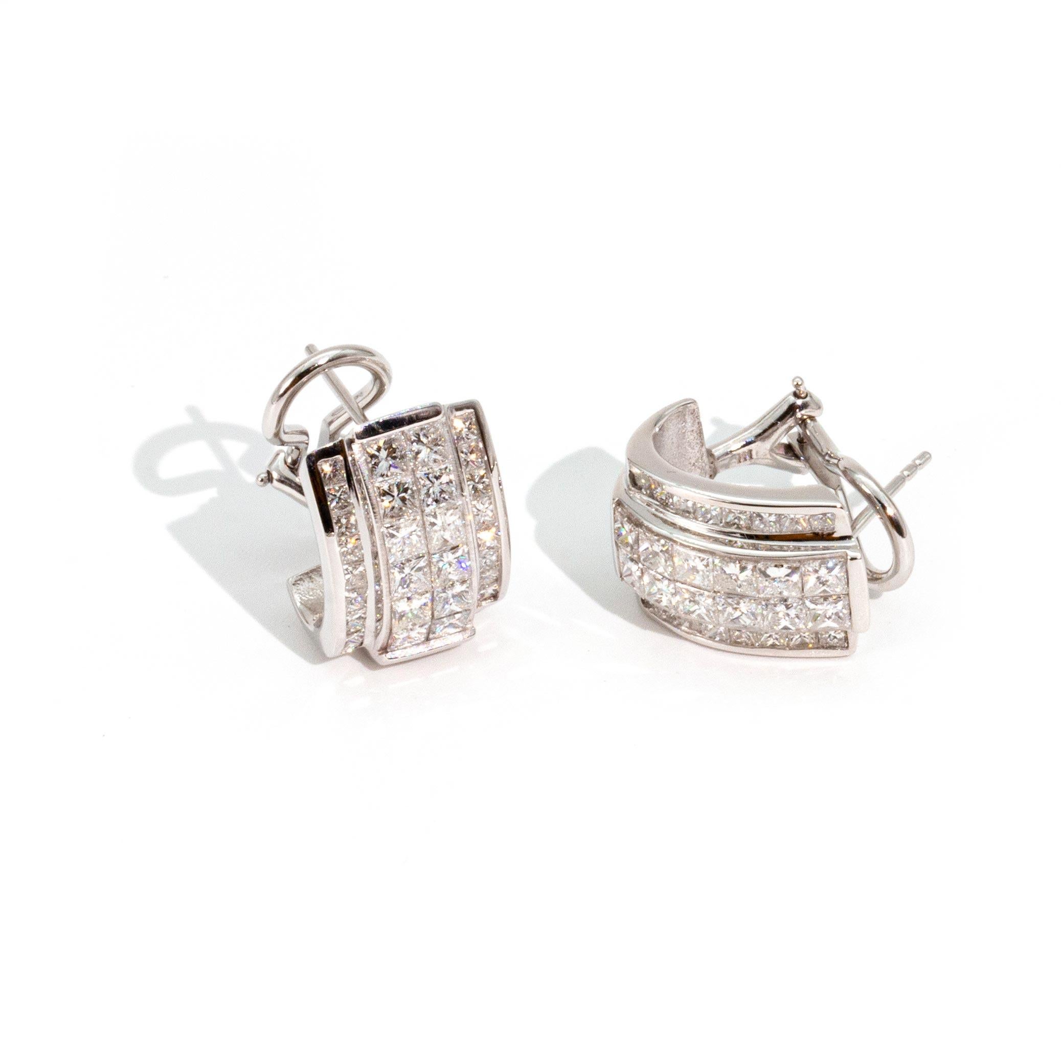 These ultimate and extremely versatile Art Deco Style Diamond and 14 Carat White Gold Earrings have both style and substance. With the appearance of a clip on earring, this design is timeless in that it could be 80s/90s style also. 

Casual enough