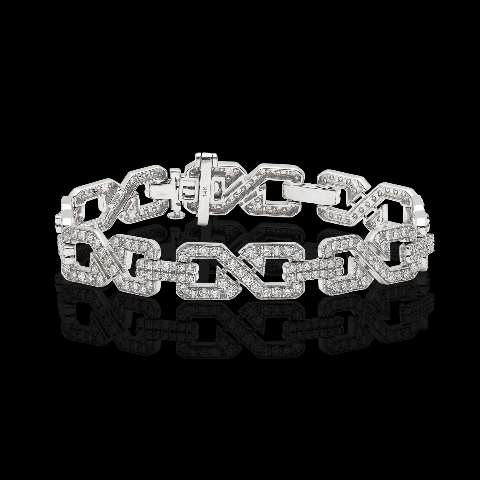 For the Art Deco style enthusiast! This 14k white gold link bracelet with geometric design is set throughout with round brilliant-cut diamonds weighing in total 3.99cts. The bracelet weighs 19.4 grams and is 7 1/4in. long, with a width of 3/8in. A