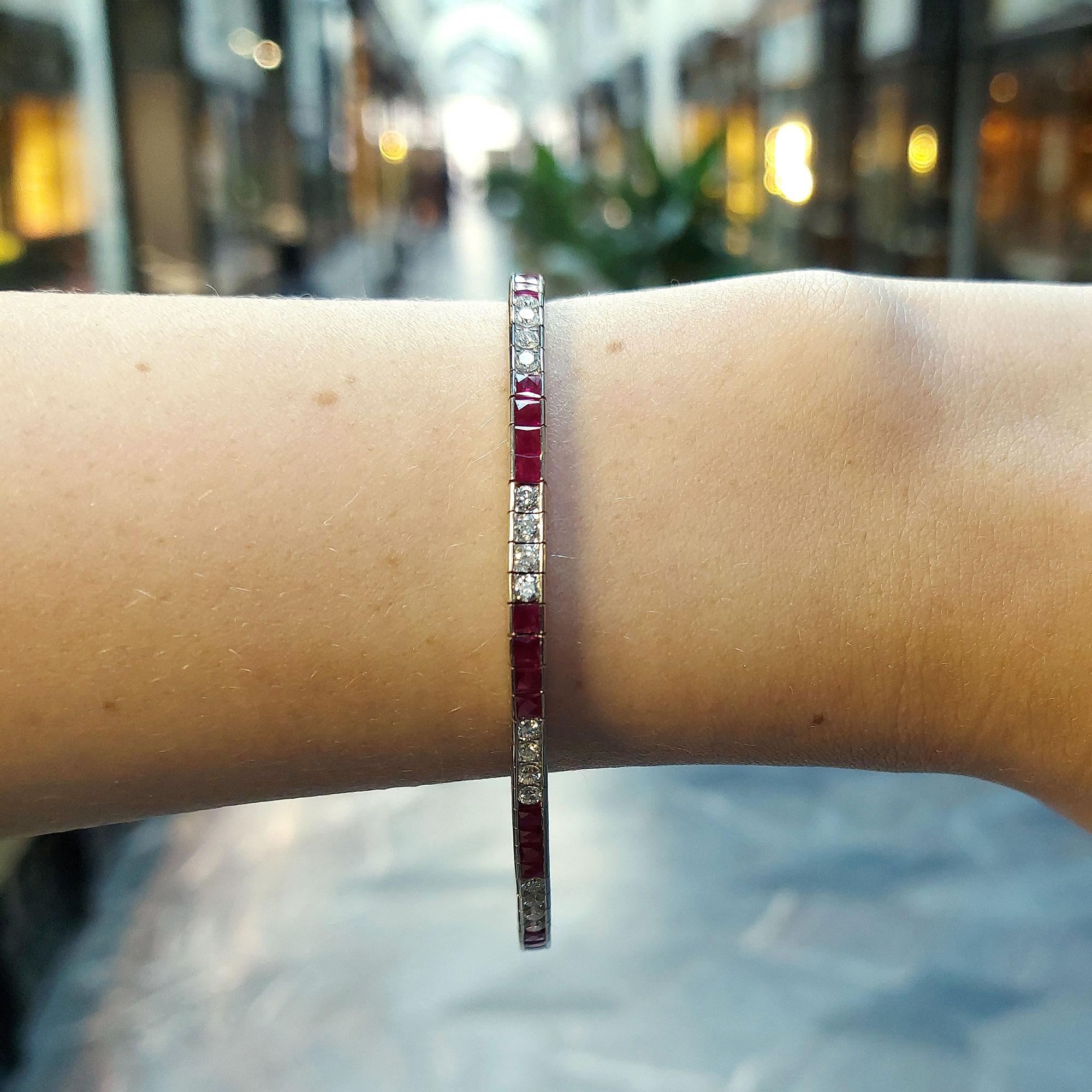 A beautiful Art Deco style ruby and diamond line bracelet set in platinum. 

The bracelet is composed of a mixture of French cut rubies and round brilliant cut diamonds. Due to the design this particular bracelet can be worn for a variety of