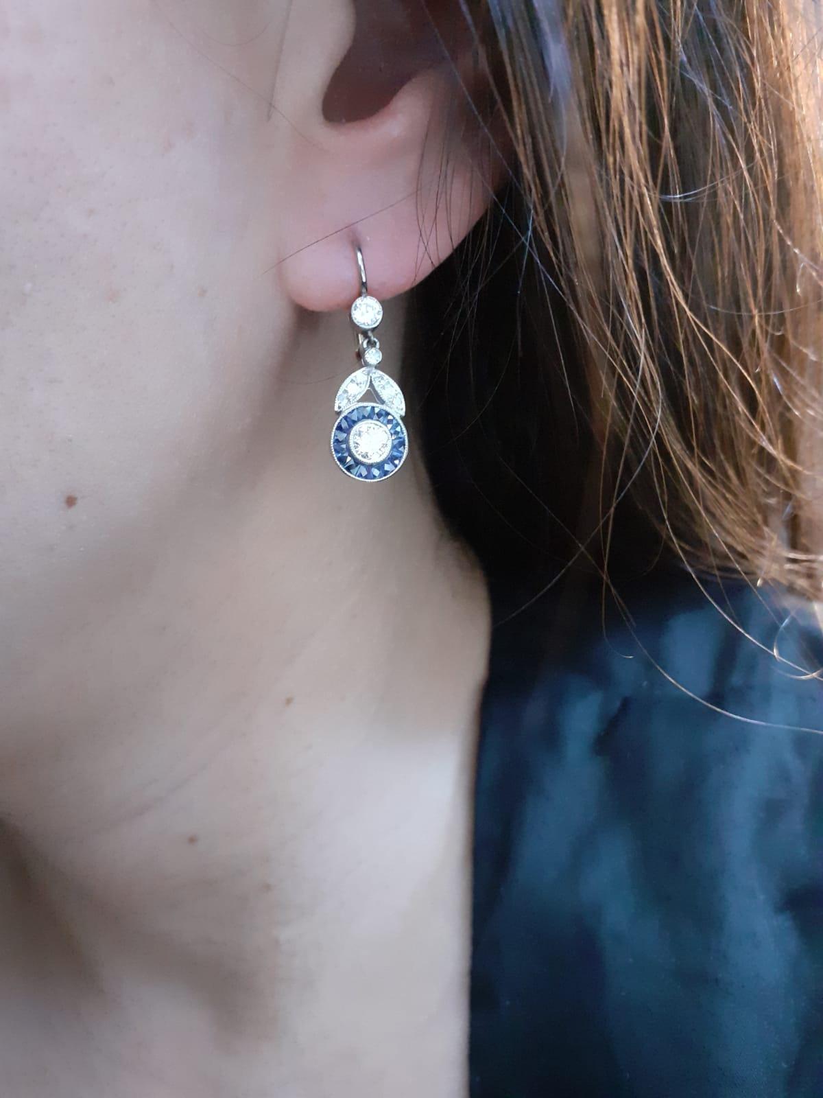 Round Cut Art Deco Style Diamond and Sapphire Floral Target Earrings in Platinum.