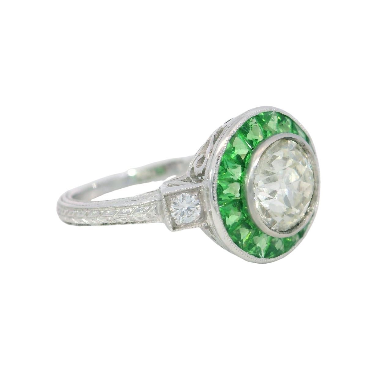 Diamond Tsavorite Halo Cluster Ring in Platinum 1.24ct Old Miner Art Deco Style

This beautifully made Art Deco style ring features a 1.24-carat round diamond (weighed outside of the setting) set in platinum, framed by a halo of natural tsavorite.