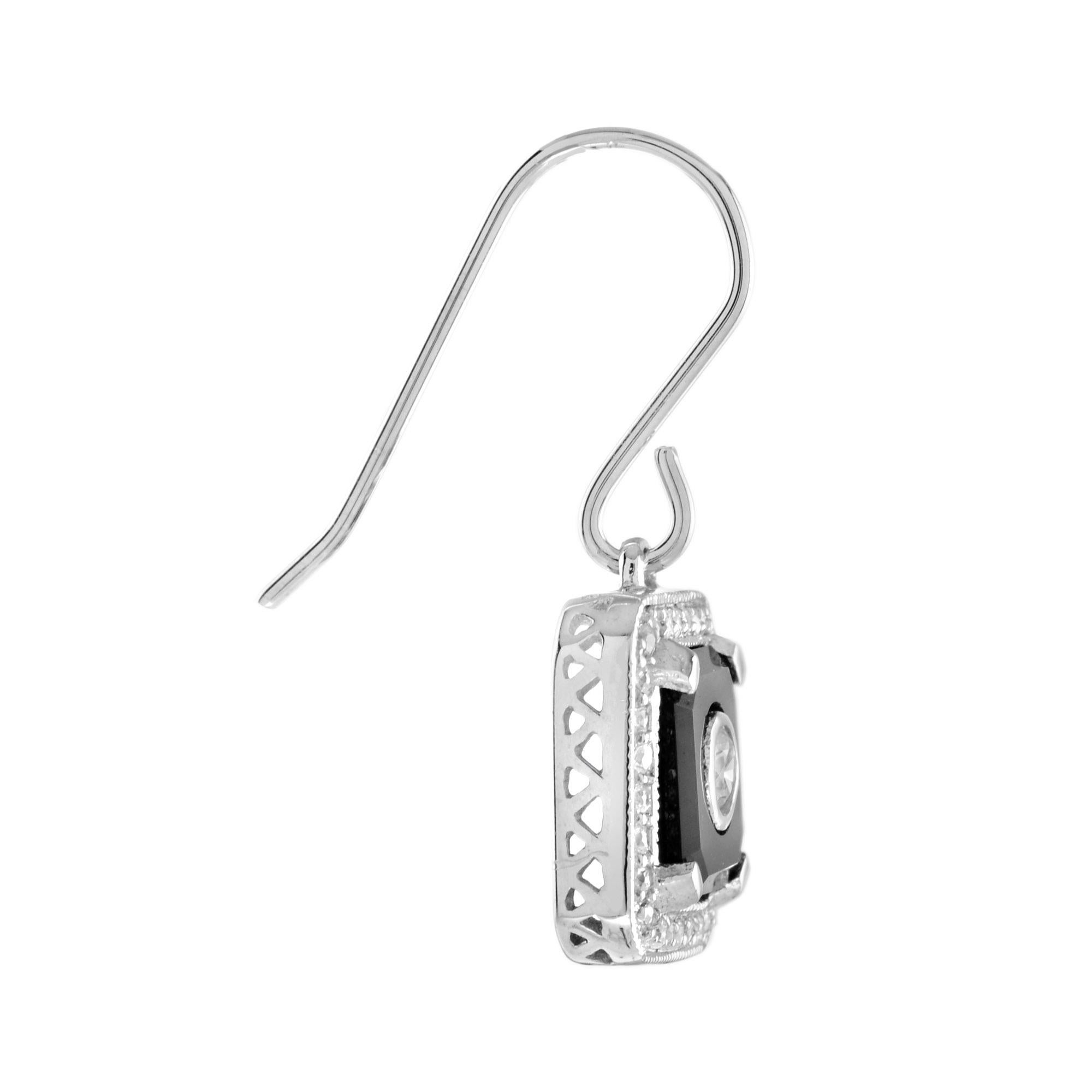 Art Deco inspired earrings with diamond halos. Polished posts and settings. 2.9 mm bezel set diamond and onyx will add a uniqueness to your outfit with the presence of onyx and a white gold movement hook. 14K White Gold. 
Information
Style: Art