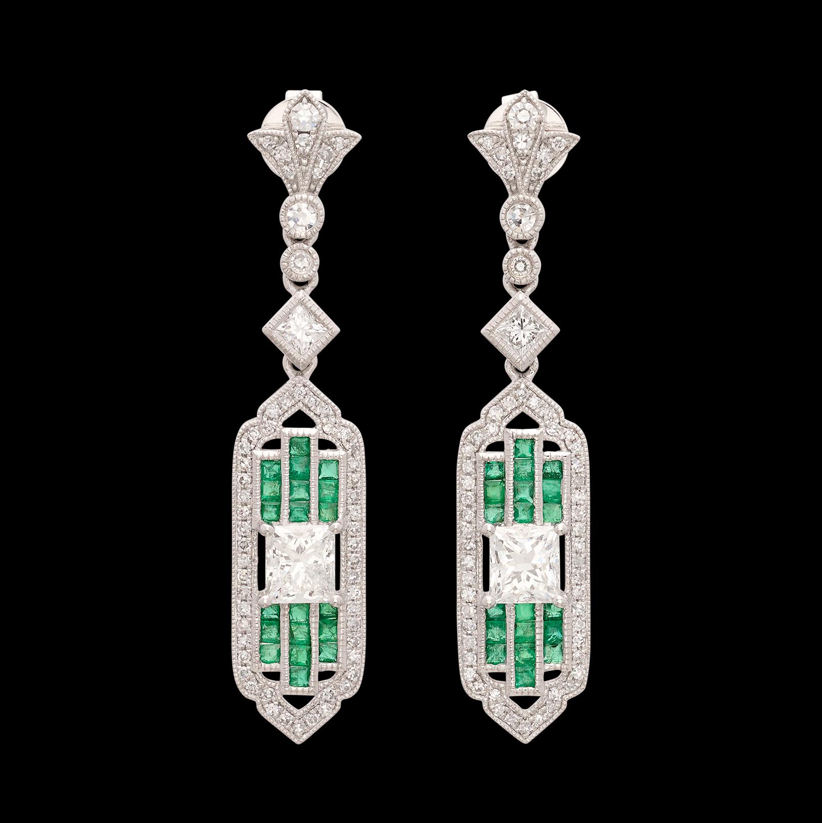 True elegance apparently can be summed up in a pair of earrings! These platinum stunners feature two extremely fine natural princess cut diamonds  graded at G-VS and weighing 1.46cttw set between rows of perfectly matched vibrant green emeralds