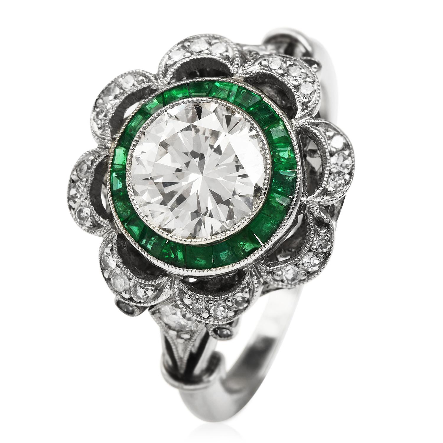 This  Art Deco design estate platinum Diamonds and Emerald ring is centered with a round-cut diamond weighing approx. 1.52 carats, M-N color, VS1 Clarity. It is surrounded by 30 French-cut Genuine Emeralds cumulatively weighing approx. 0.50 carats