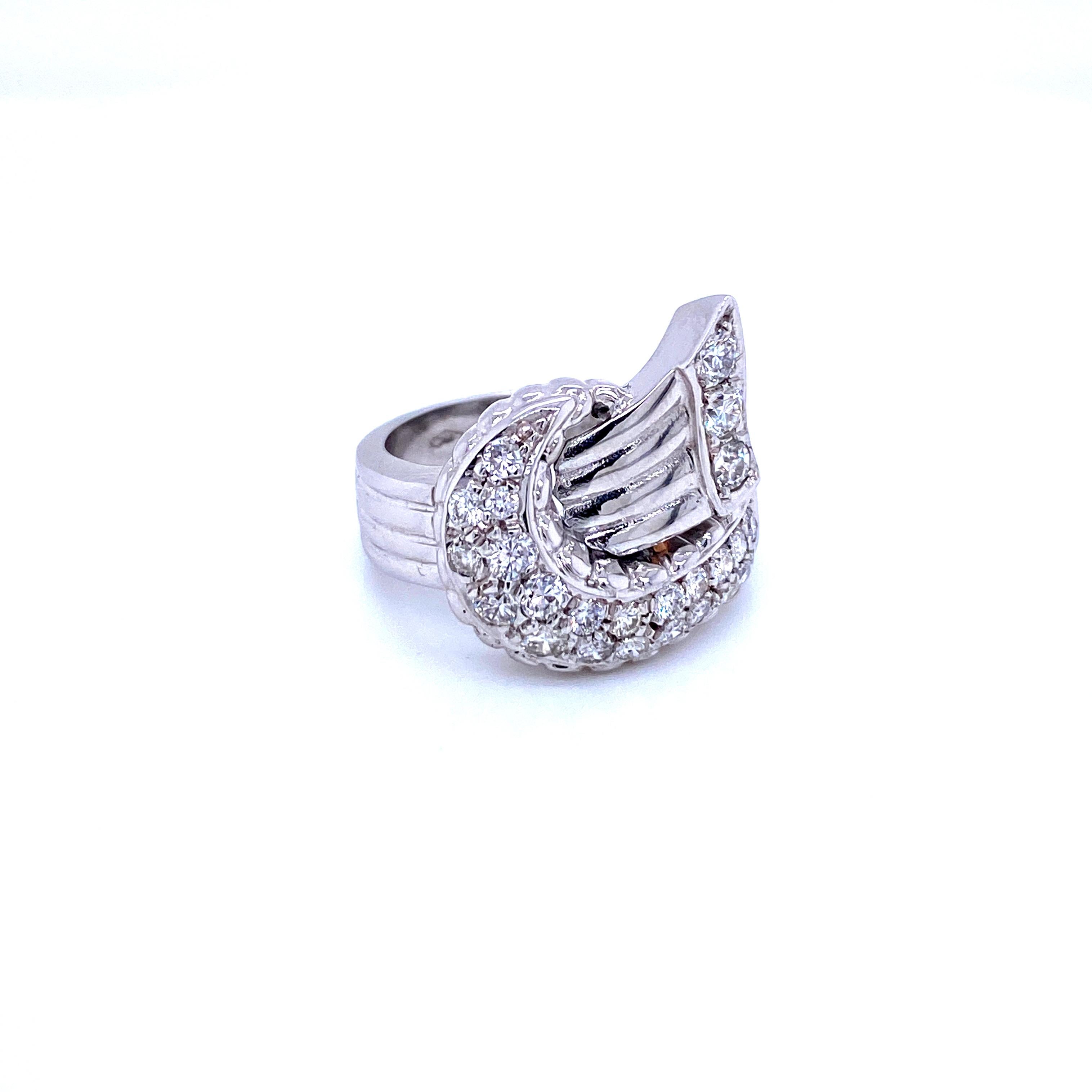 Unusual Art Deco Style ring hand crafted in 18k white Gold.
It is set with sparkling Round brilliant Cut Diamonds, pave setting, total weight 1.05 carats graded G color Vs2 clarity. 


Ring Size: US 8,5 - IT 18 - FR 58 - UK Q/R - resizable, free of