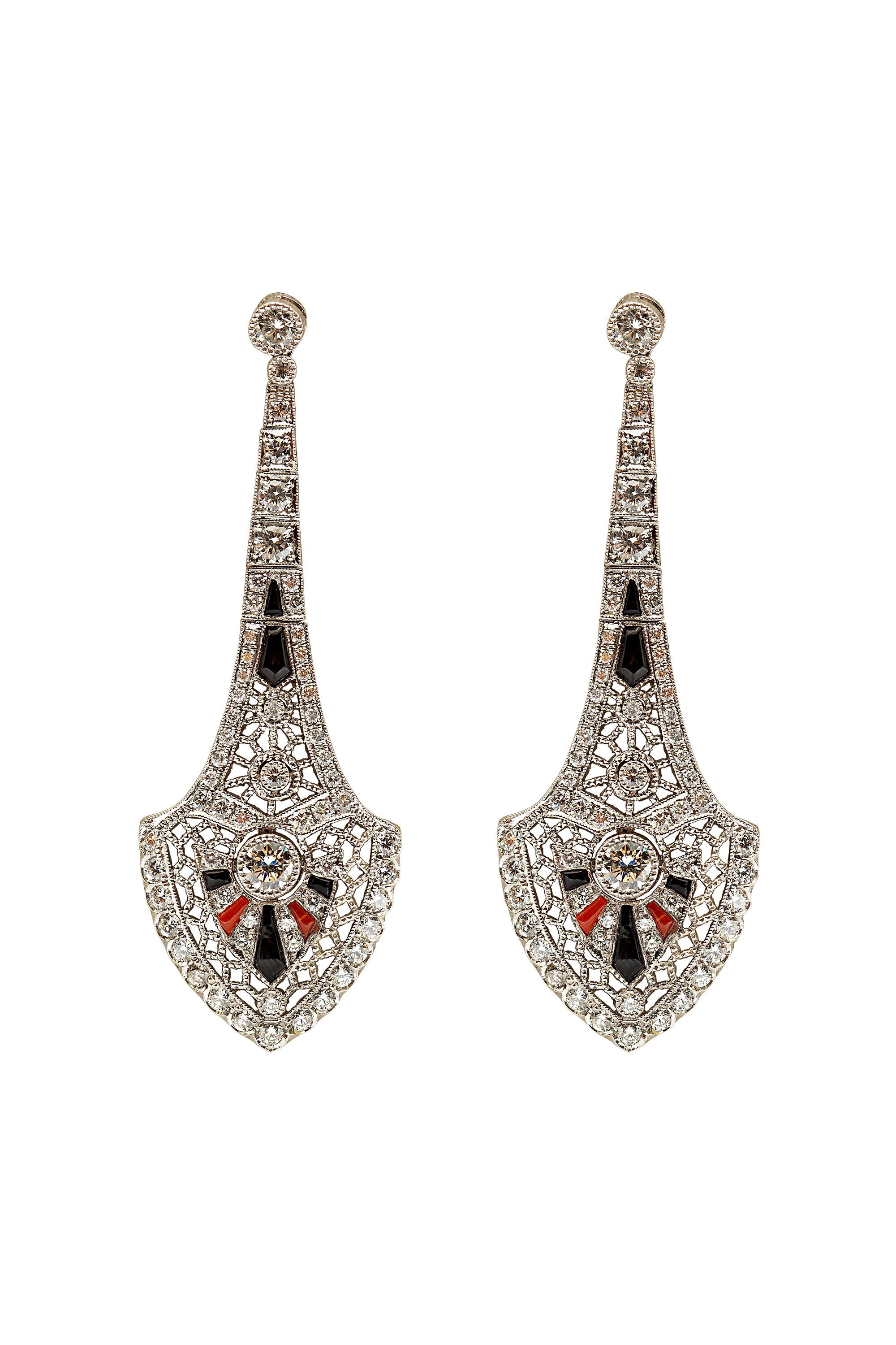 Intricate design and craftsmanship by Gems Are Forever, Inc, this gorgeous earrings are inspired by Art Deco era and crafted in platinum. The earrings have 4.70 carats diamond and are accented with black onyx and coral. Designed and finished by Gems