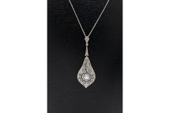 Colgante Art Déco de oro de 14K y platino con diamantes, circa 1940, 0,34 ct