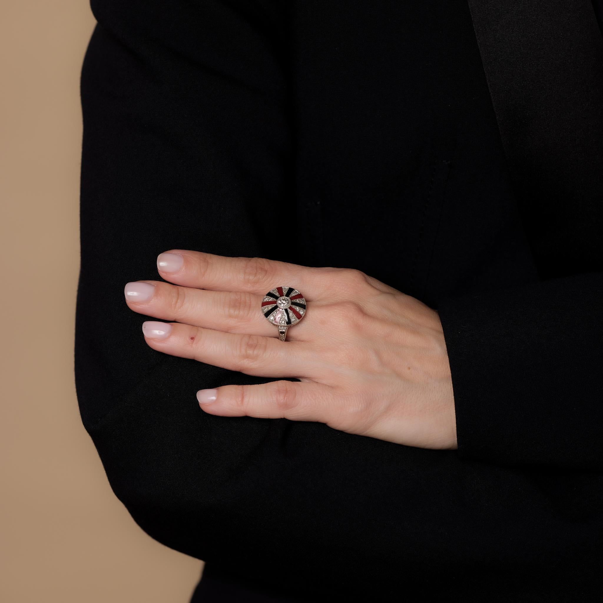 This vintage Art Deco style platinum cocktail ring showcases a .40-carat old European cut diamond, accented by 28 single cut diamonds totaling .30 carats, H-I color, and VS clarity, with vibrant red and black enamel. Crafted in the 2000s, it is