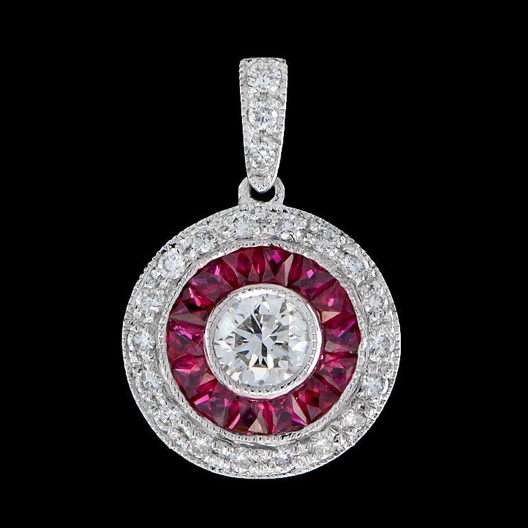 This Art-Deco pendant is completely spectacular! The vibrant color stone Ruby is a specialty cut to surround the excellent round brilliant cut center diamond, which is in a thin bezel with mil-grain detail.
Information
Style: Art Deco
Width: 12