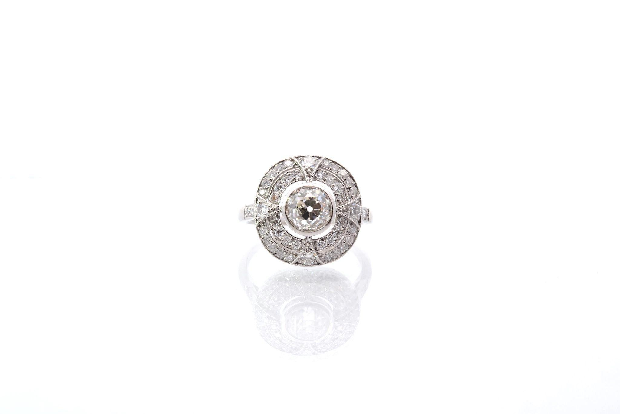 Stones: 1 diamond of 1.23 cts old cut I SI1, 46 diamonds: 0.50ct
Material: Platinum
Dimensions: 1.3cm
Weight: 6g
Period: Recent handmade art deco style
Size: 54 (free sizing)
Certificate
Ref. : 25363 25309
