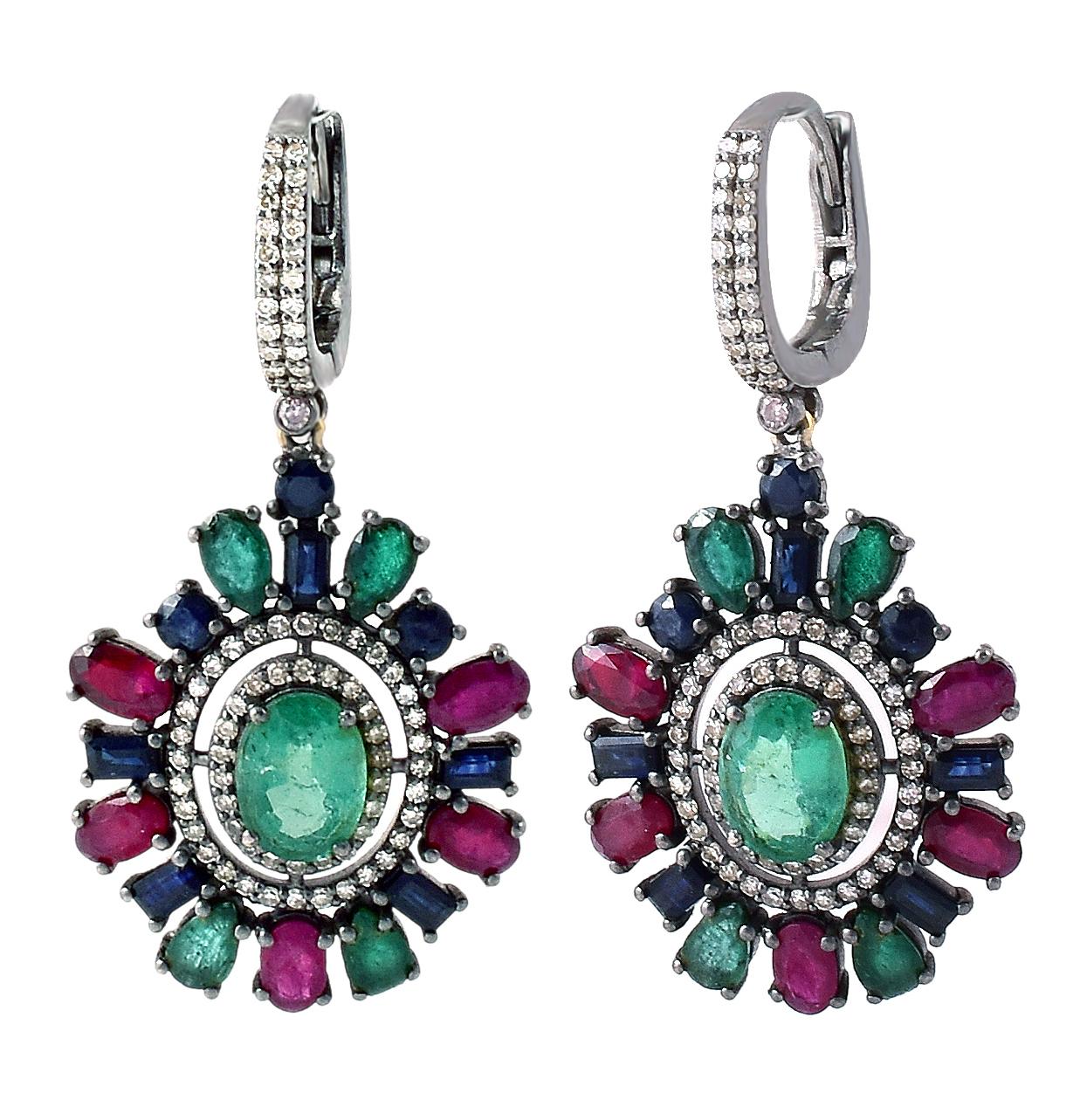 Art-Deco Style Diamond, Ruby, Sapphire, and Natural Emerald Drop Earrings

This art-deco lively glorious precious stone and diamond earring is magnificent. The center solitaire emerald is beautifully surrounded with a single row of pave diamond