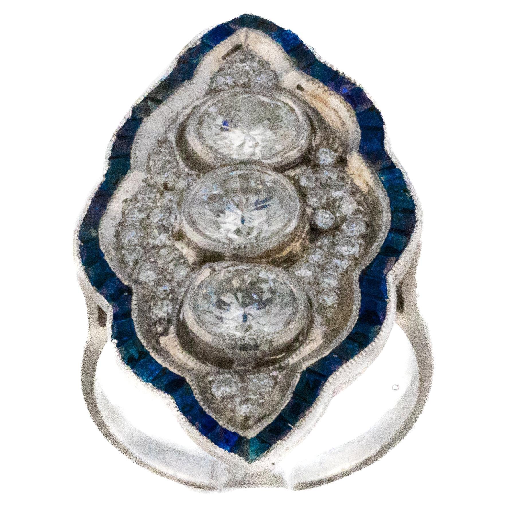 Bague de style Art déco avec diamant et saphir en forme de navette