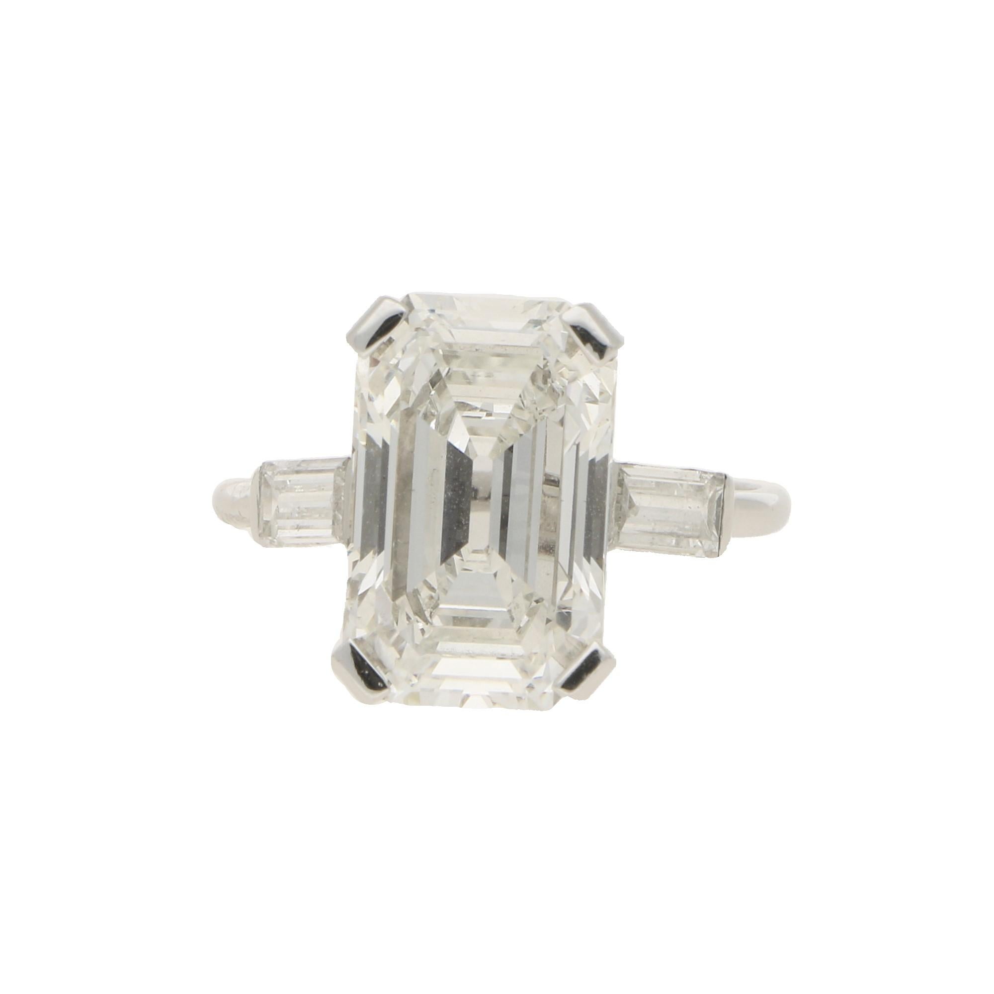 A simply beautiful Art Deco Style cut cornered rectangular step cut diamond engagement ring, set in platinum. This stunning central stone is GIA certified as a 3.75 carat diamond, assessed as F colour and VVS2 clarity - spectacular specifications