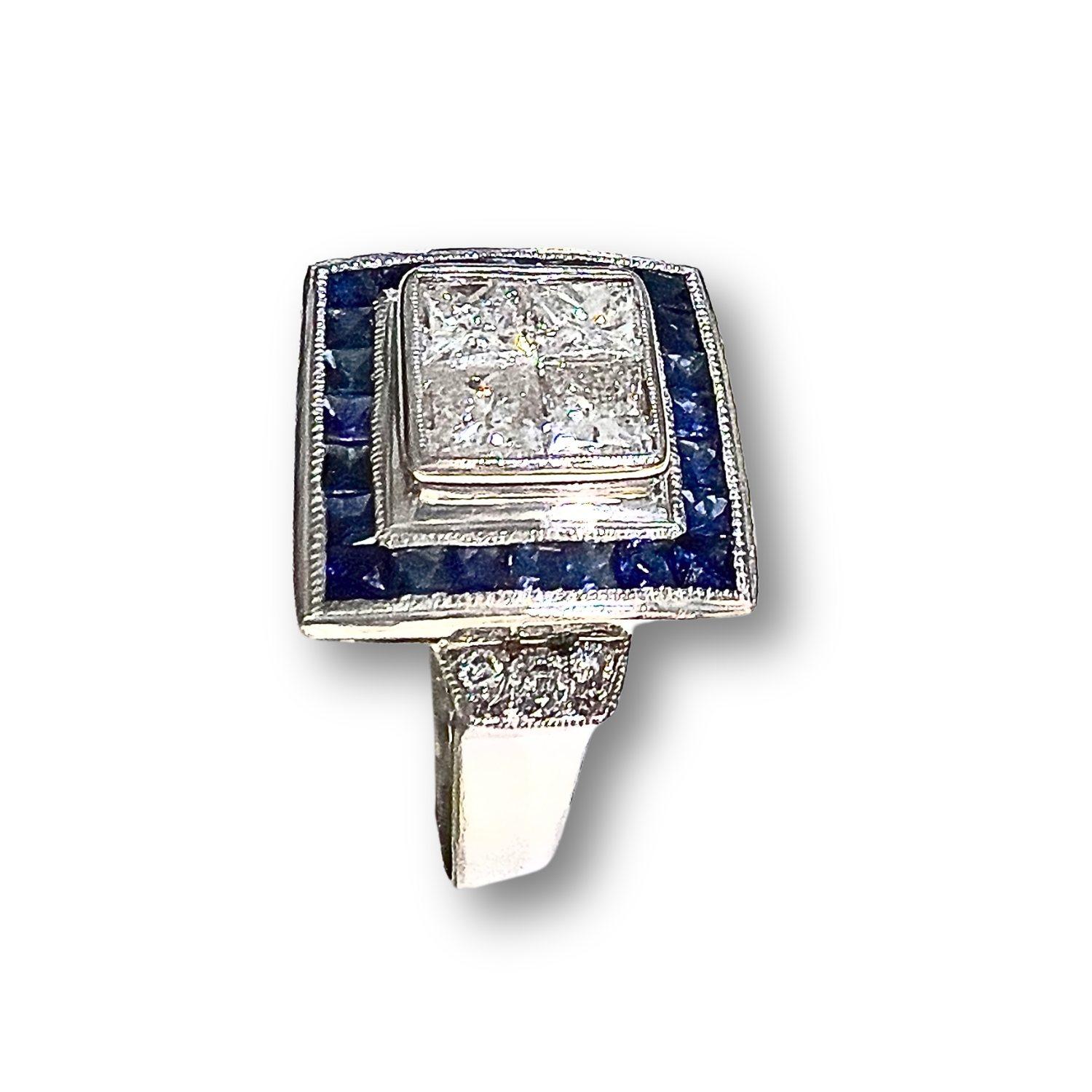 
Indulge in the exquisite elegance of the Art Deco era with this stunning platinum ring featuring 18k white gold accents, adorned with a mesmerizing array of diamonds and sapphires. This ring is a true masterpiece of craftsmanship and