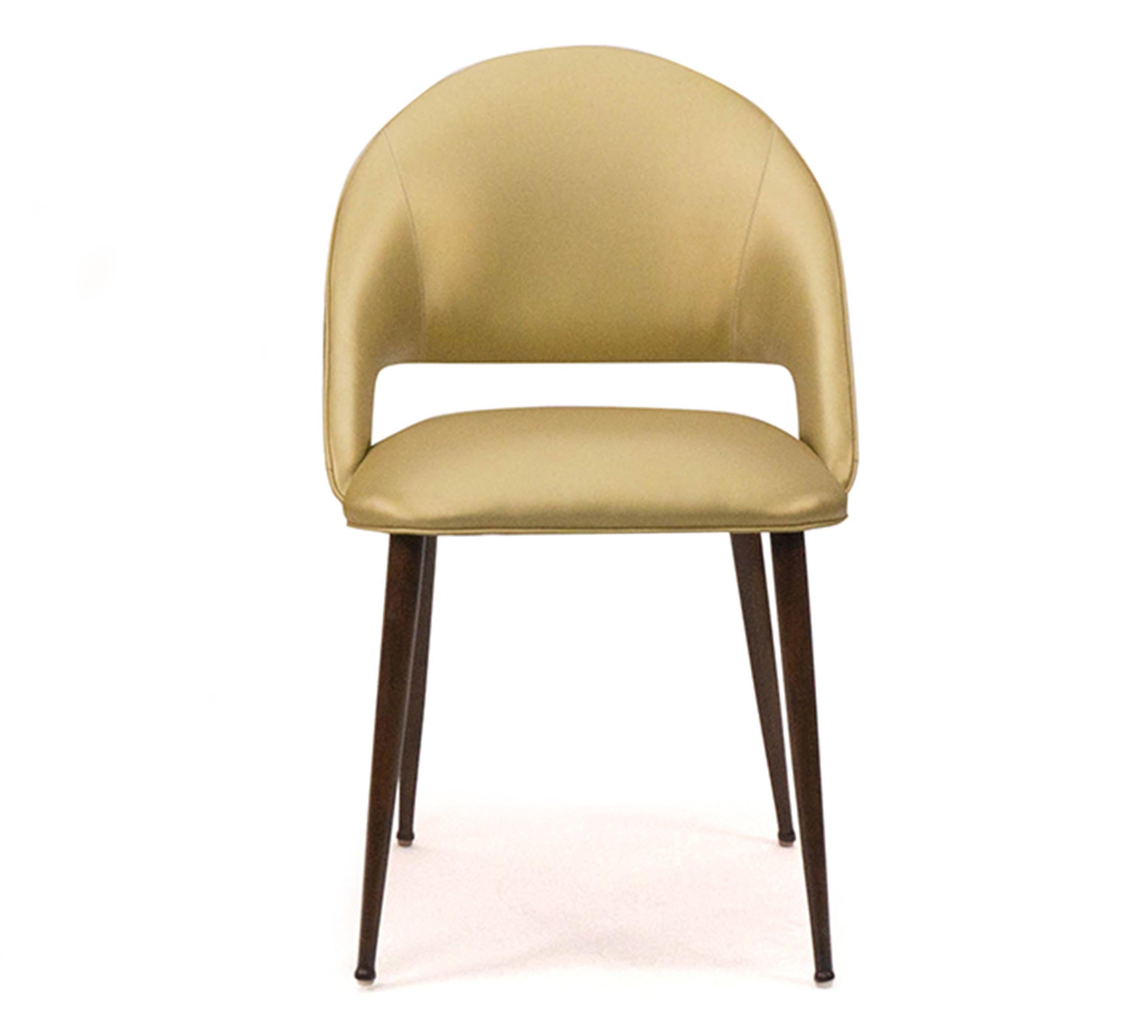 Art Deco inspired dining chair with round turned legs upholstered in a performance vinyl that comes in many colors. Features top-stitching detail. 

Available COM at $1300/ea.

Dimensions
Outside measurements: 22