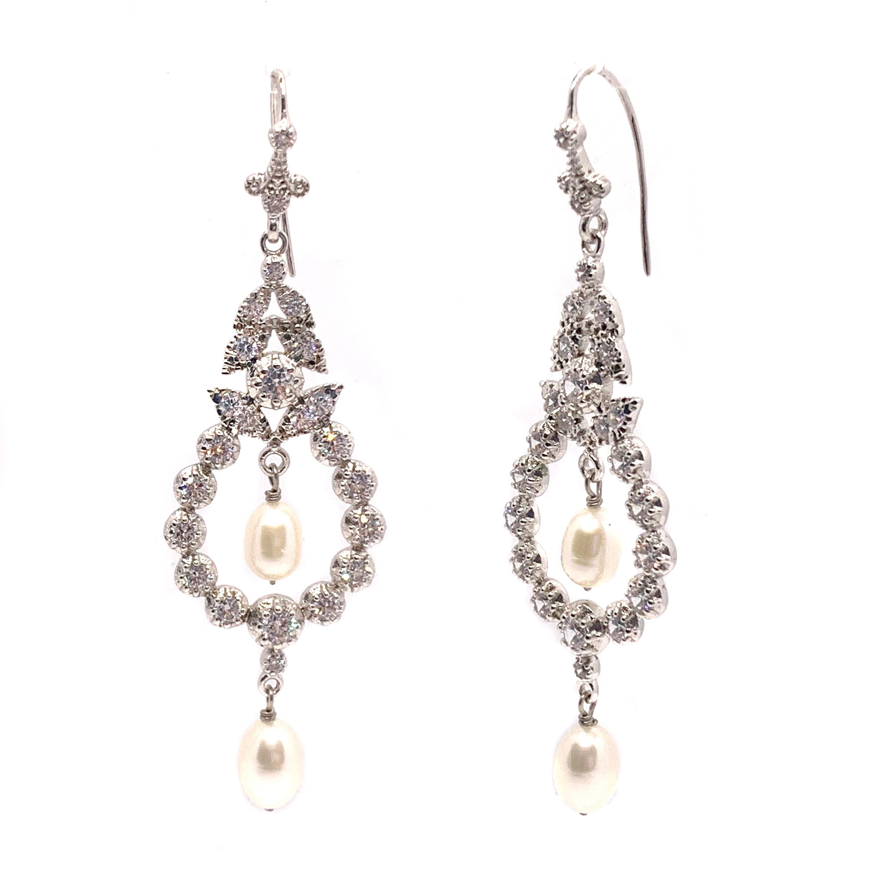 Art Deco Style Double Freshwater Pearl Drop Hook Earrings

These stunning Art Deco style earrings feature two pair of lustrous freshwater pearls and 52pcs of round simulated diamond, handset in platinum rhodium plated sterling silver with fish hook.